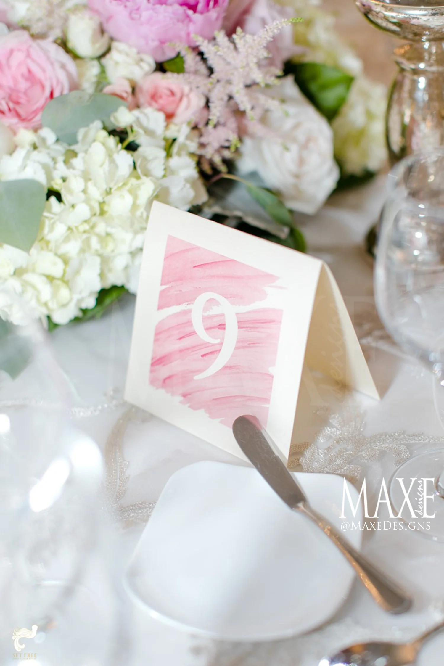 Amanda & Alex's Florida Wedding - a beautiful watercolor was the perfect complement to their table décor. 
