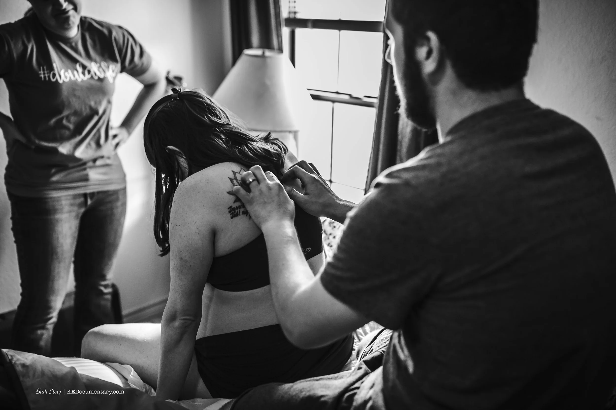 husband supporting wife at their birth