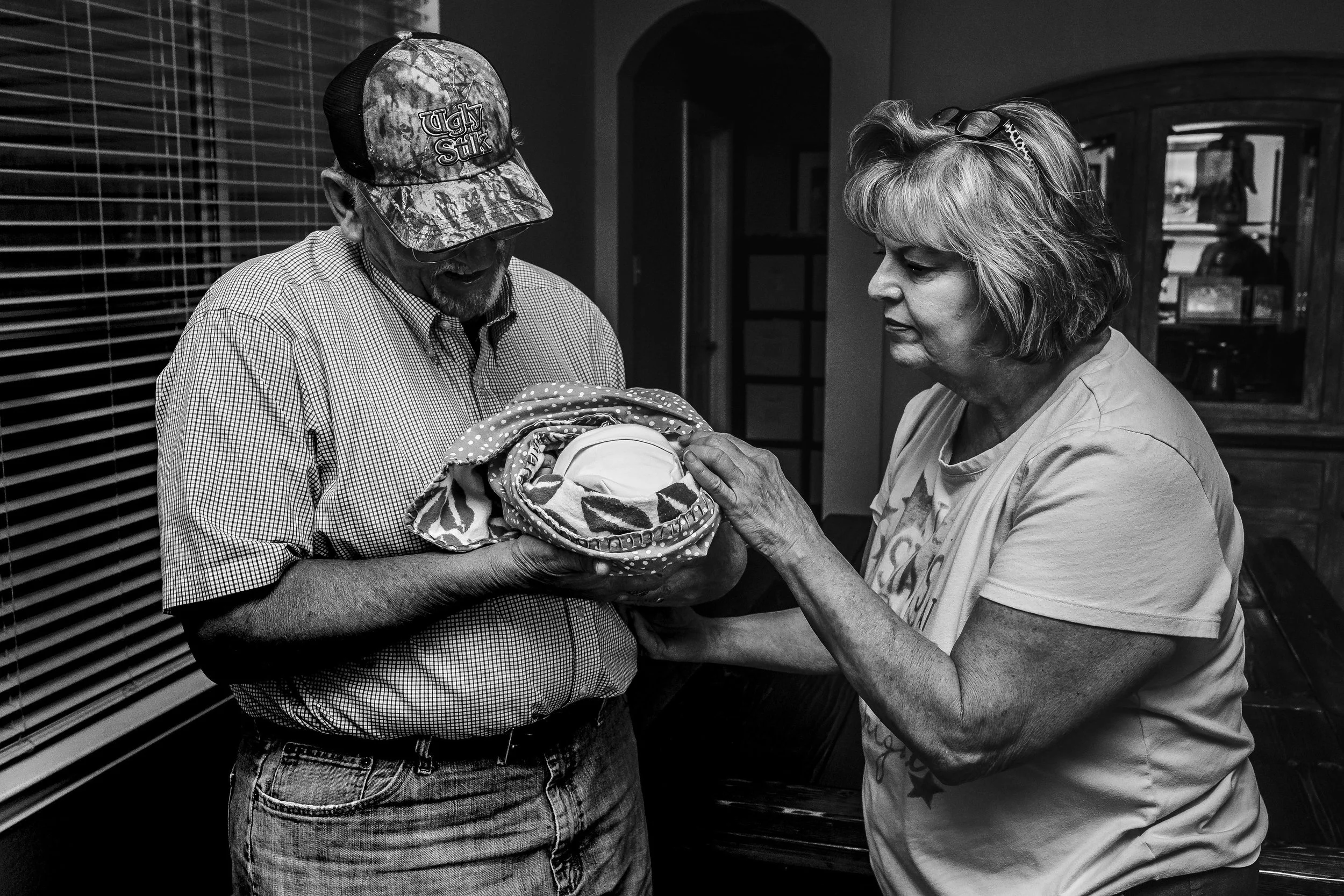 grandparents meeting their granddaughter