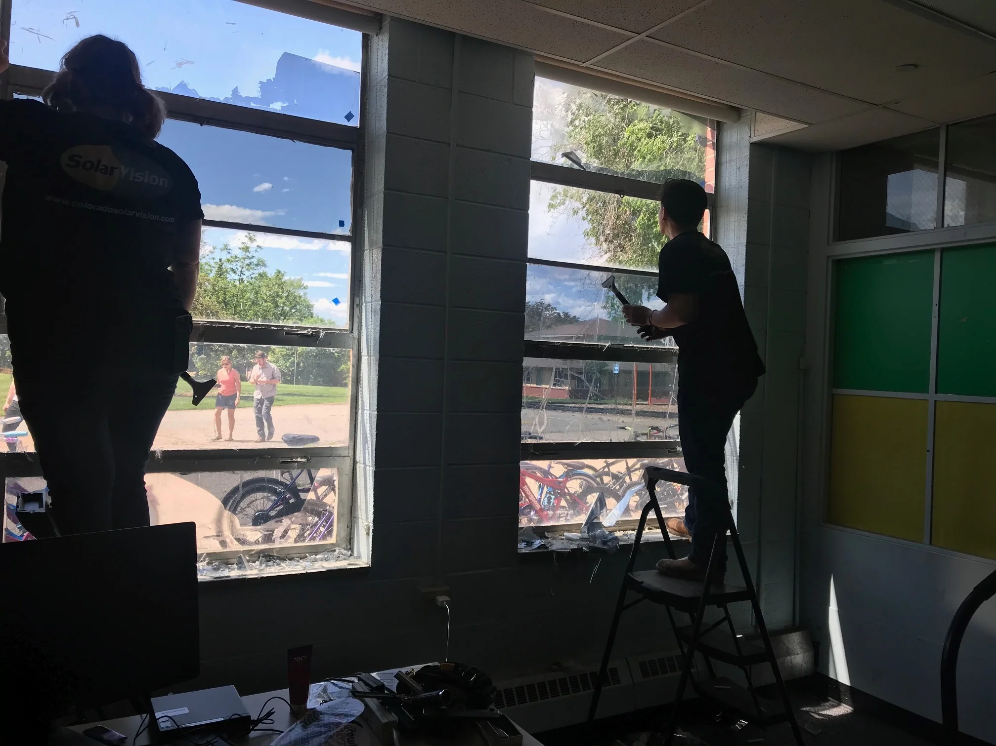 Susie Schurr and Bryan Gonzales removing very old film.