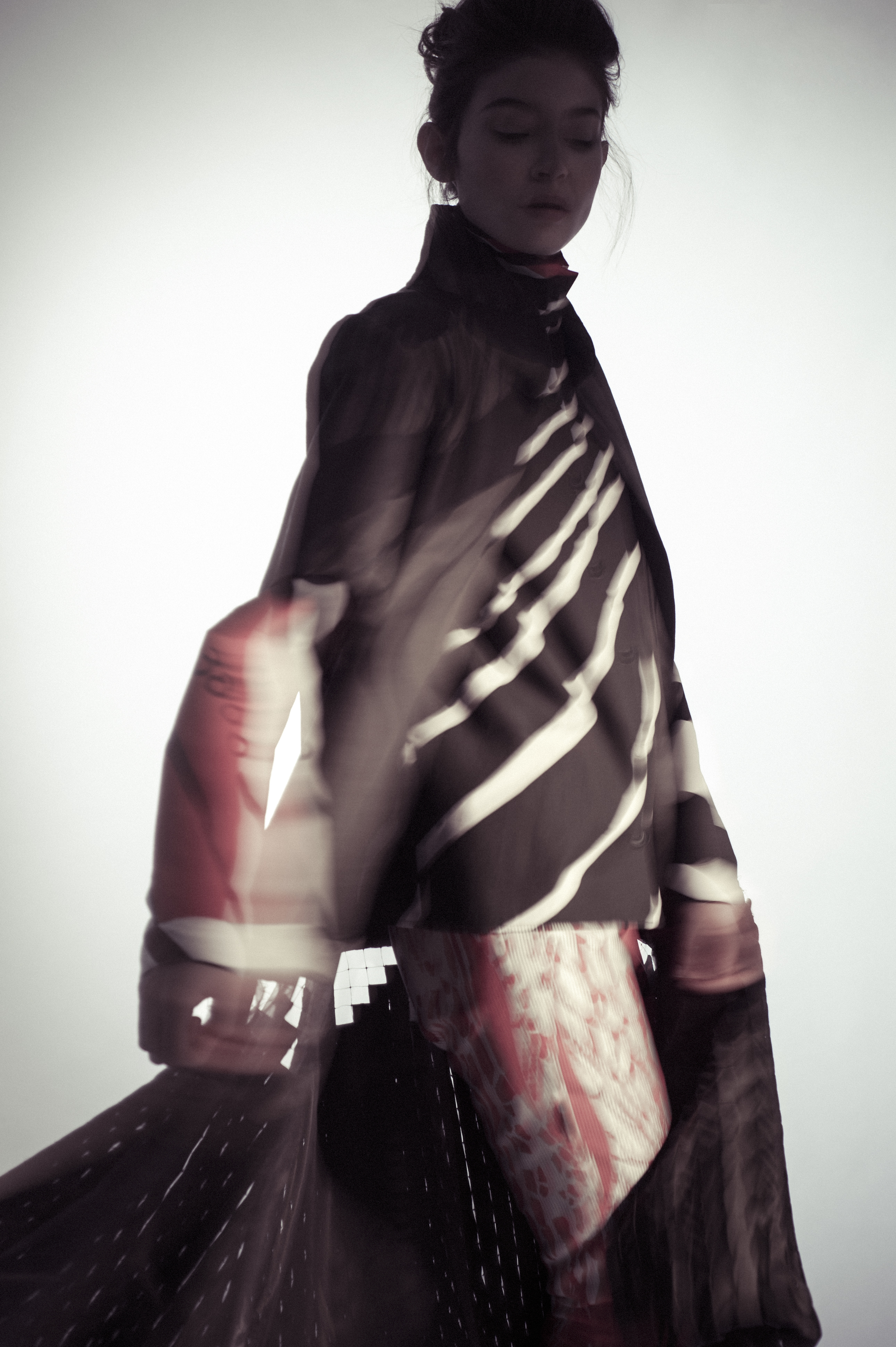 Coat, shirt, and pants by Ernest Huang, MFA Fashion Design and Hong Ni, MFA Textile Design. Socks, stylist's own. Shoes, Aldo. 