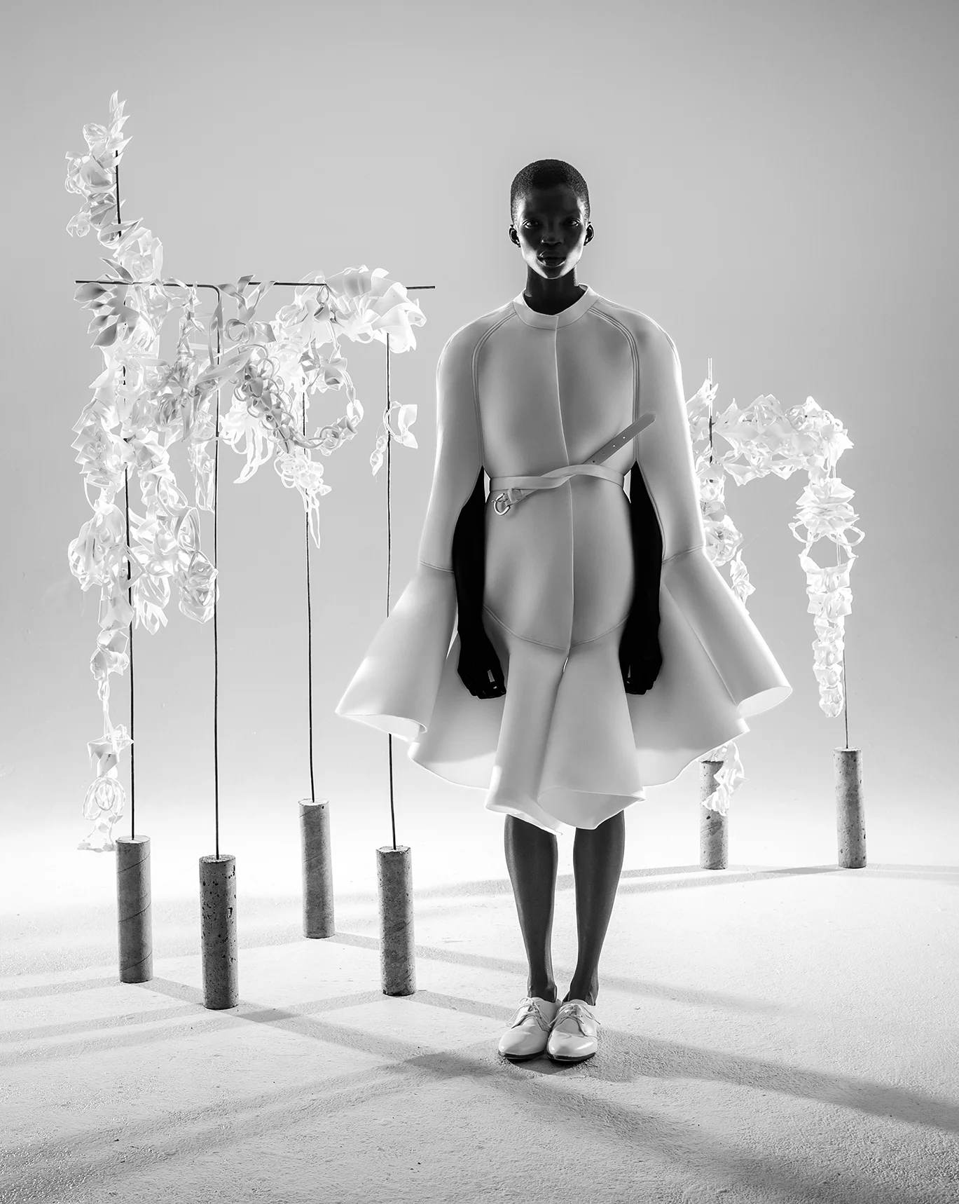Cape by Nika Tang, MFA Fashion Design. Belt and shoes stylist's own. Prosthetic models from the School of Architecture. 