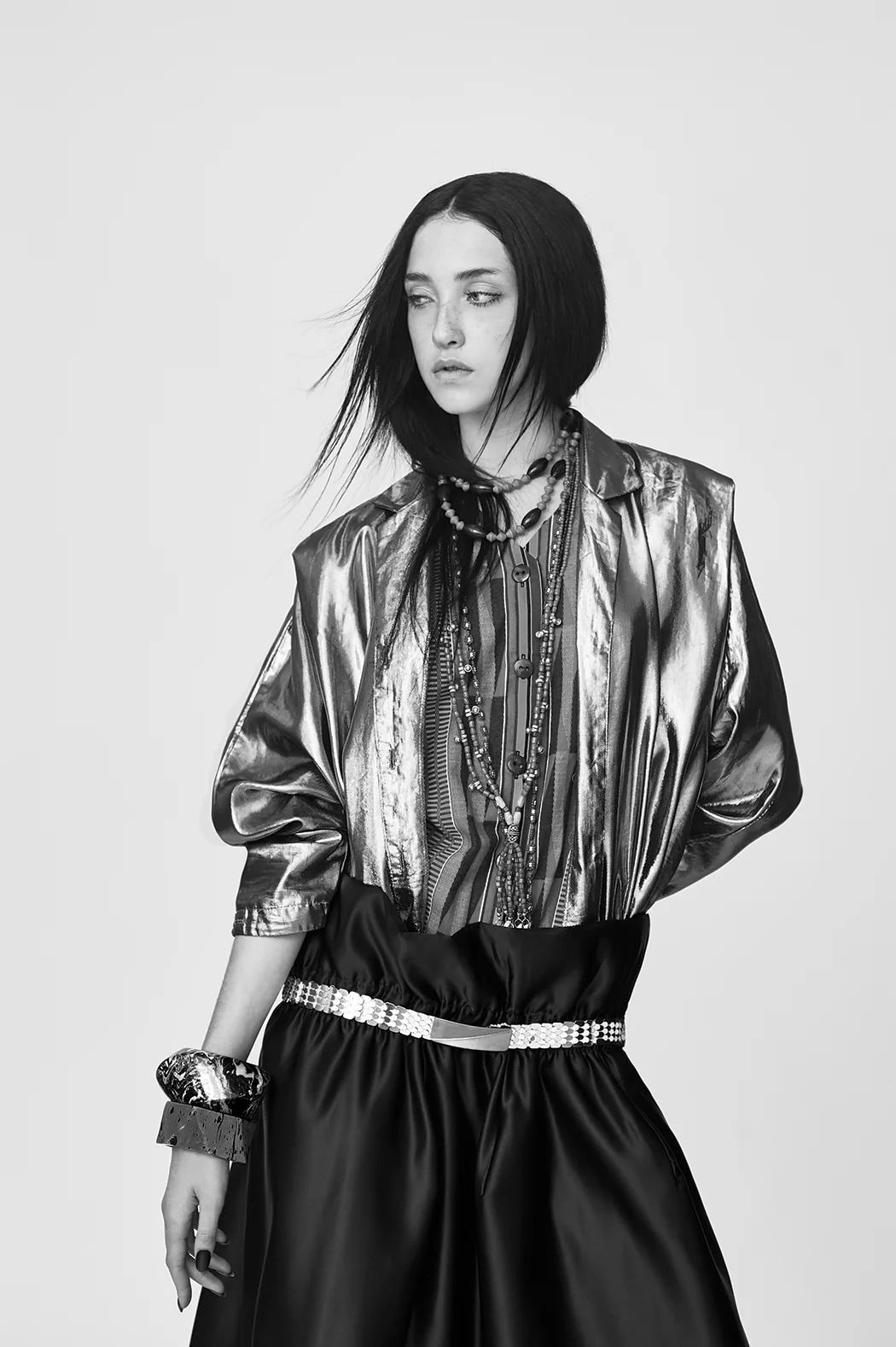 Skirt by Jiaqi Lu, BFA Fashion Design. Vintage Metallic Jacket, Vintage African Jumpsuit, and Belt. All jewelry, stylist's own.