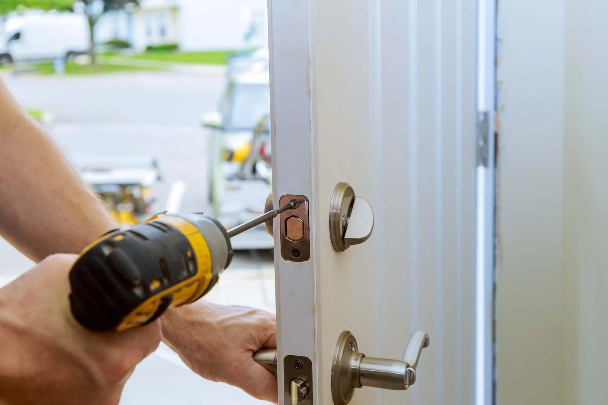 workers-hands-installing-new-door-locker-man-repai-WCCMG4L.jpg