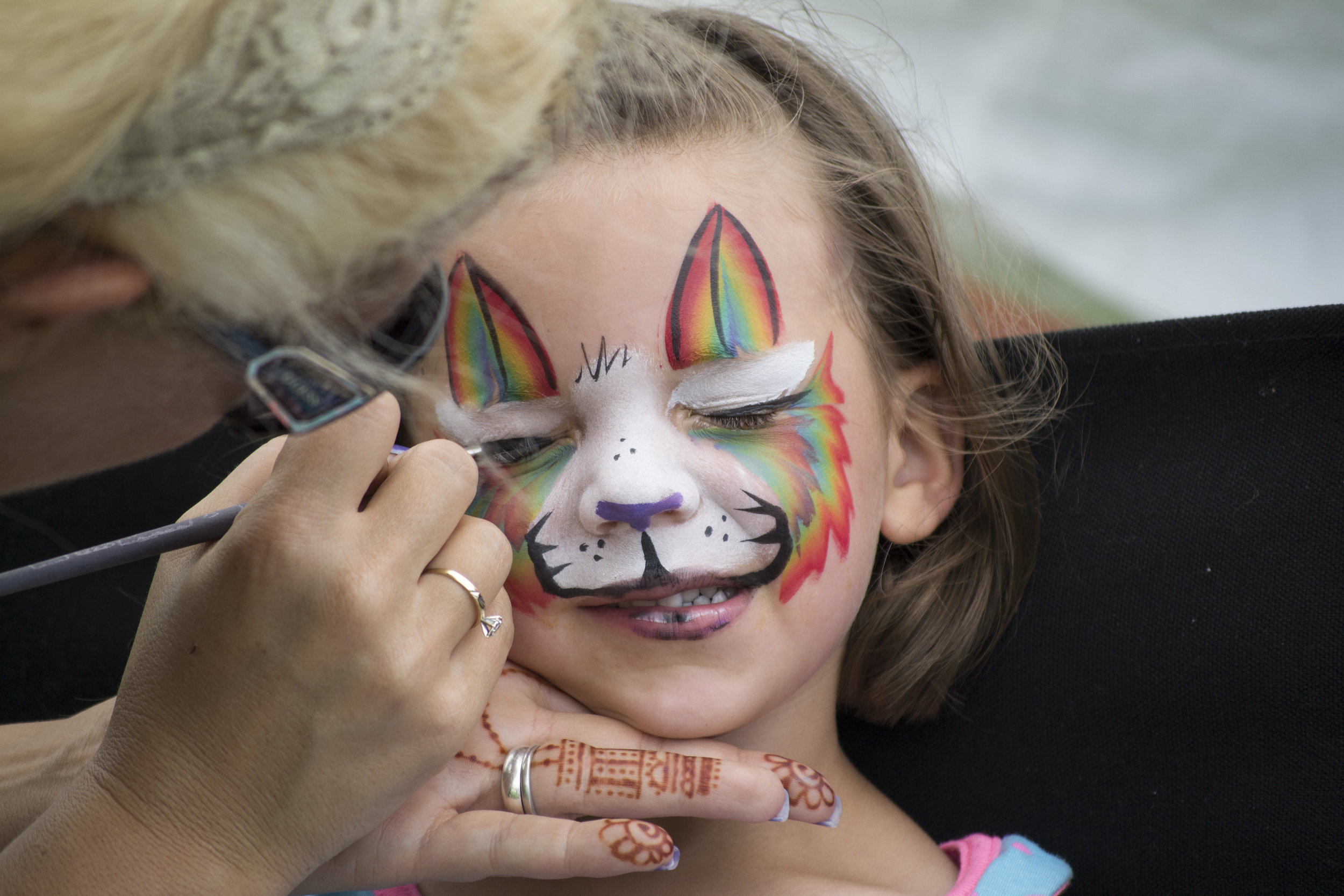 Violet waits patiently as her face is painted at the Community Picnic hosted by the First United Methodist Church in St. Joseph, Michigan on June 14, 2015. (For St. Joseph FUMC)