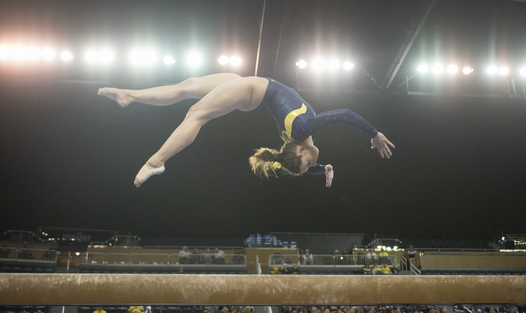  Lindsay Williams performs on the beam at a tri meet on February 8, 2016. 