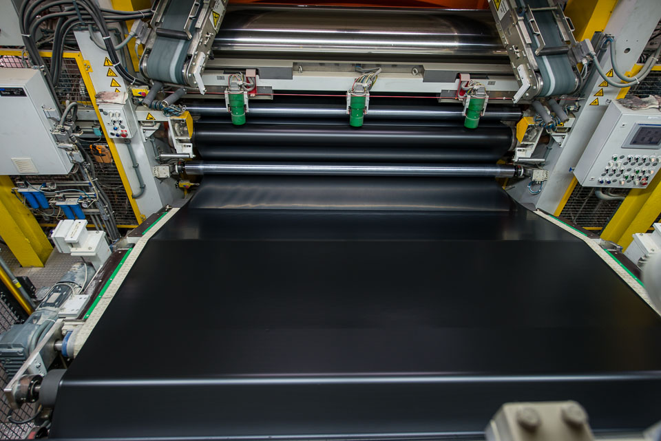 extruded membrane prior to entering the doubling roll that will combine two layers into one membrane.