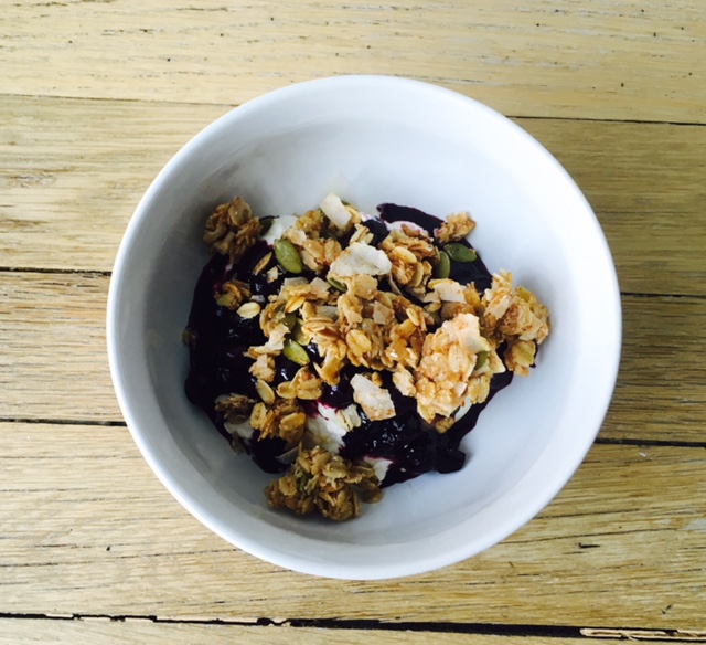 Gluten free granola with blueberry compote over raw milk yogurt