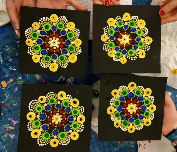 Mandalas following the Kente cloth - inspired pattern, dotted by grade 5 students.