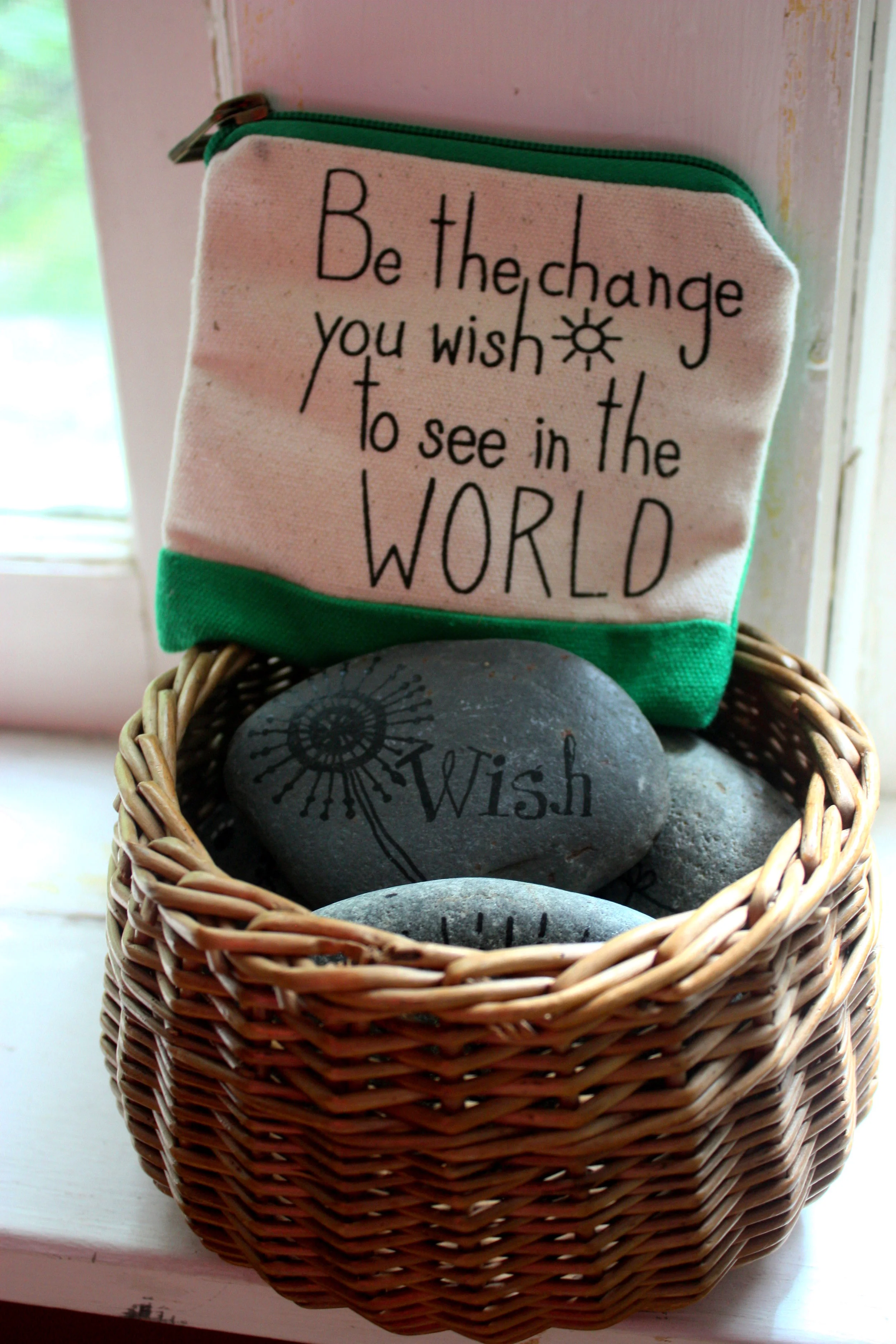 I keep the original basket of rocks in my workspace along with the little change purse pictured here. It was given to me by a student around the same time the rock basket made it's first appearance on my desk. Together, they remind me of why I'm doing what I'm doing.