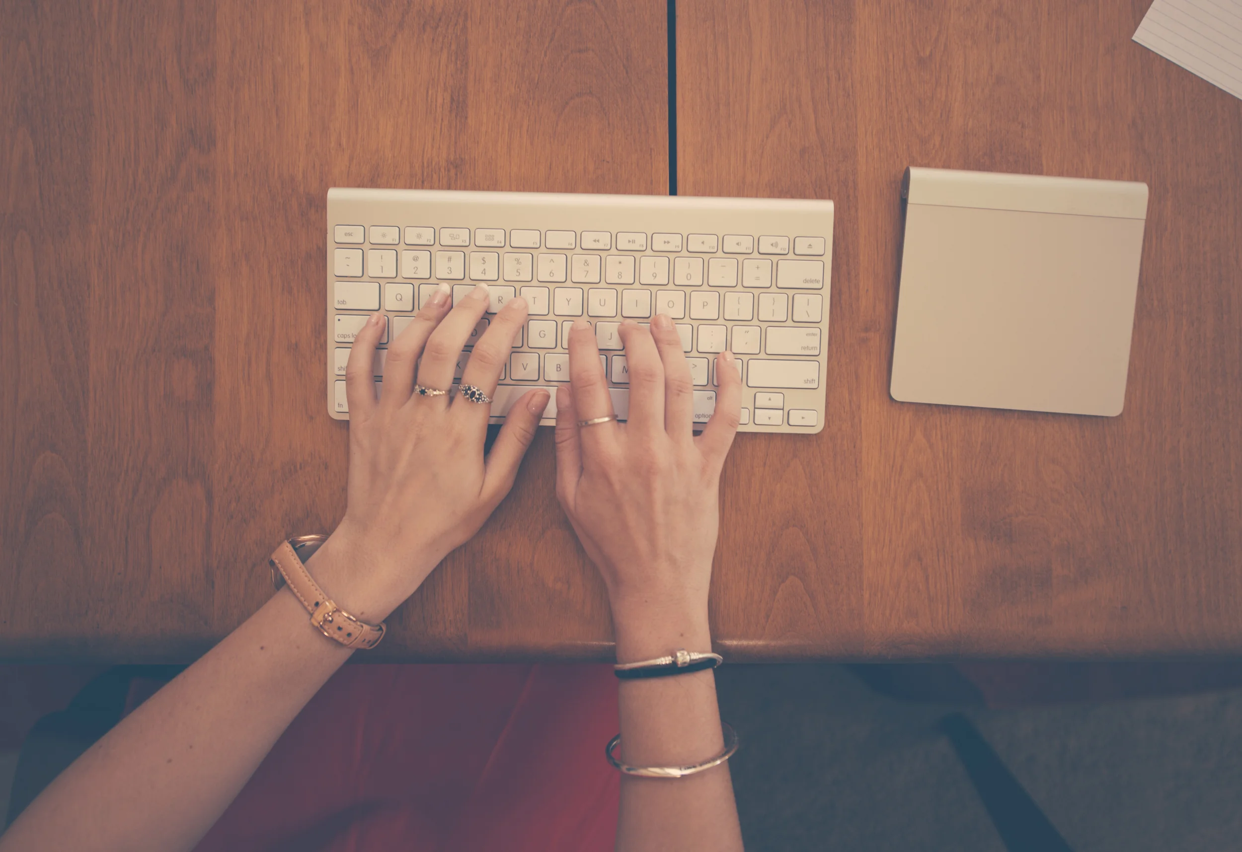 hands-woman-apple-desk.jpg