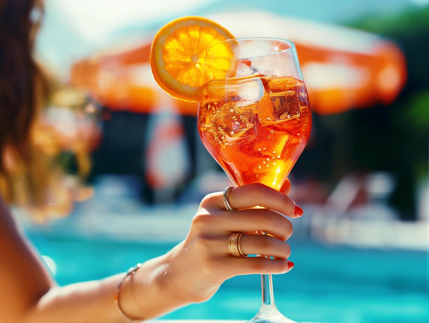 Sipping on sunshine with a touch of @aperolusa. This refreshing spritz is the perfect poolside companion. #aperol #aperolspritz #aperoltime #poolparty