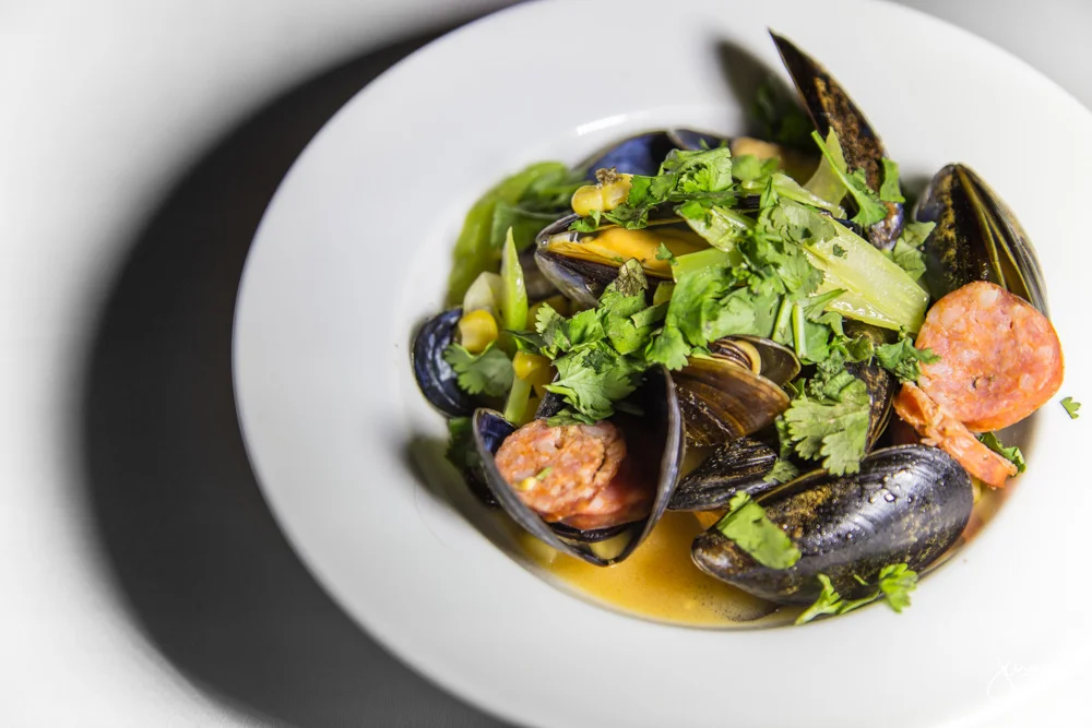 BC Mussels - tomato wine broth, chorizo, corn, braised celery, cilantro