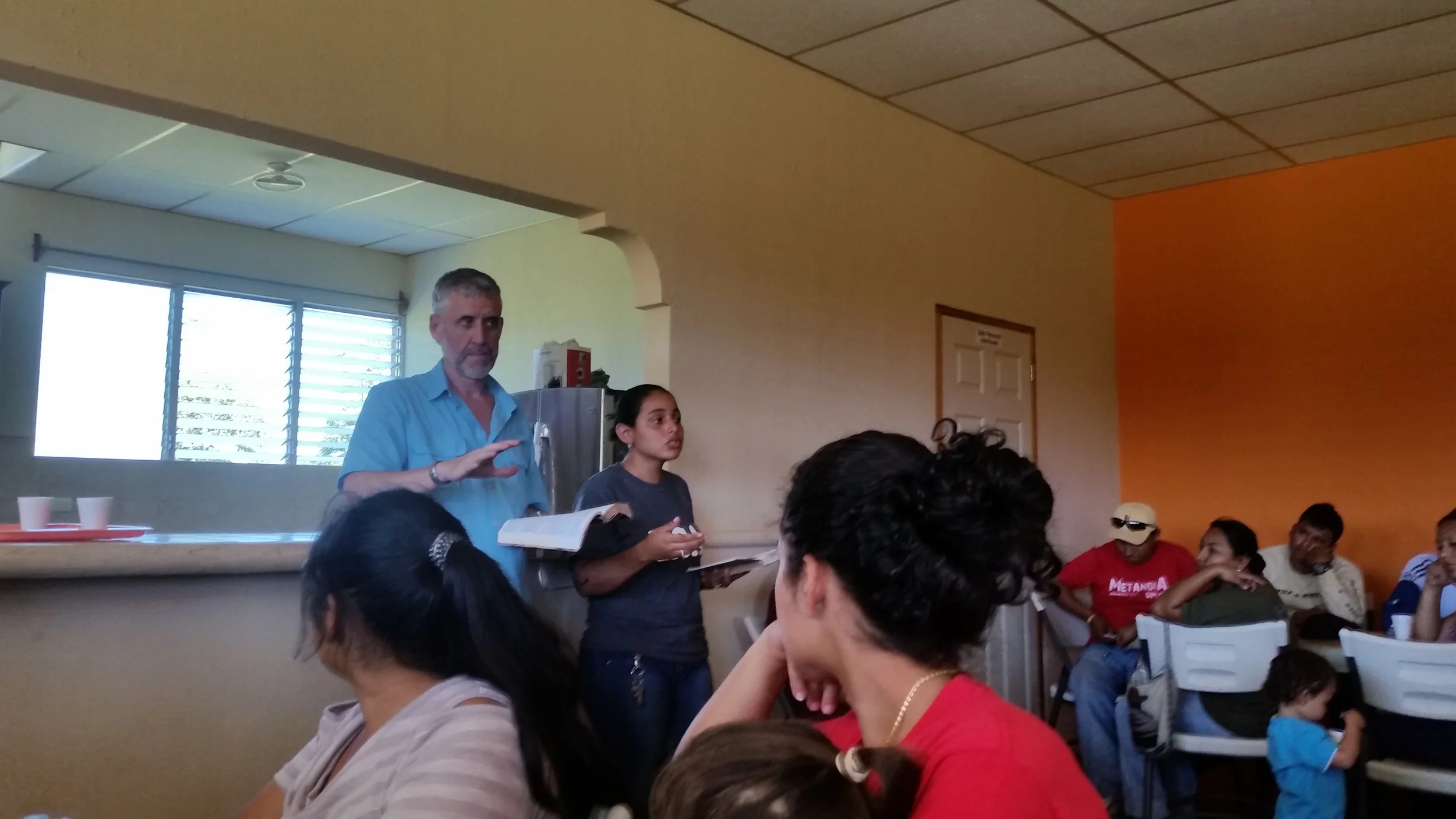 Bernie sharing God's word with Mineyla translating