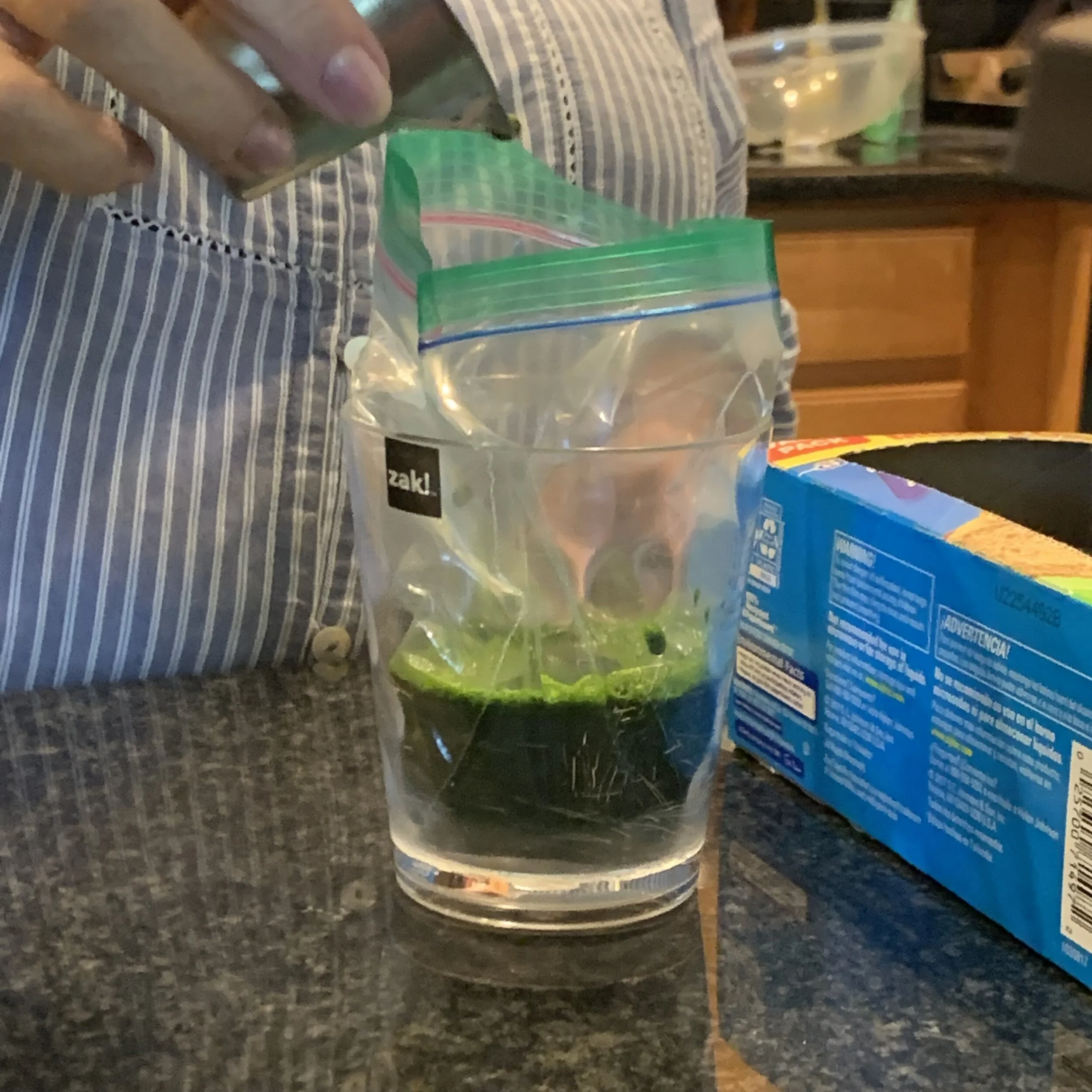 Line a cup with a baggie for juice