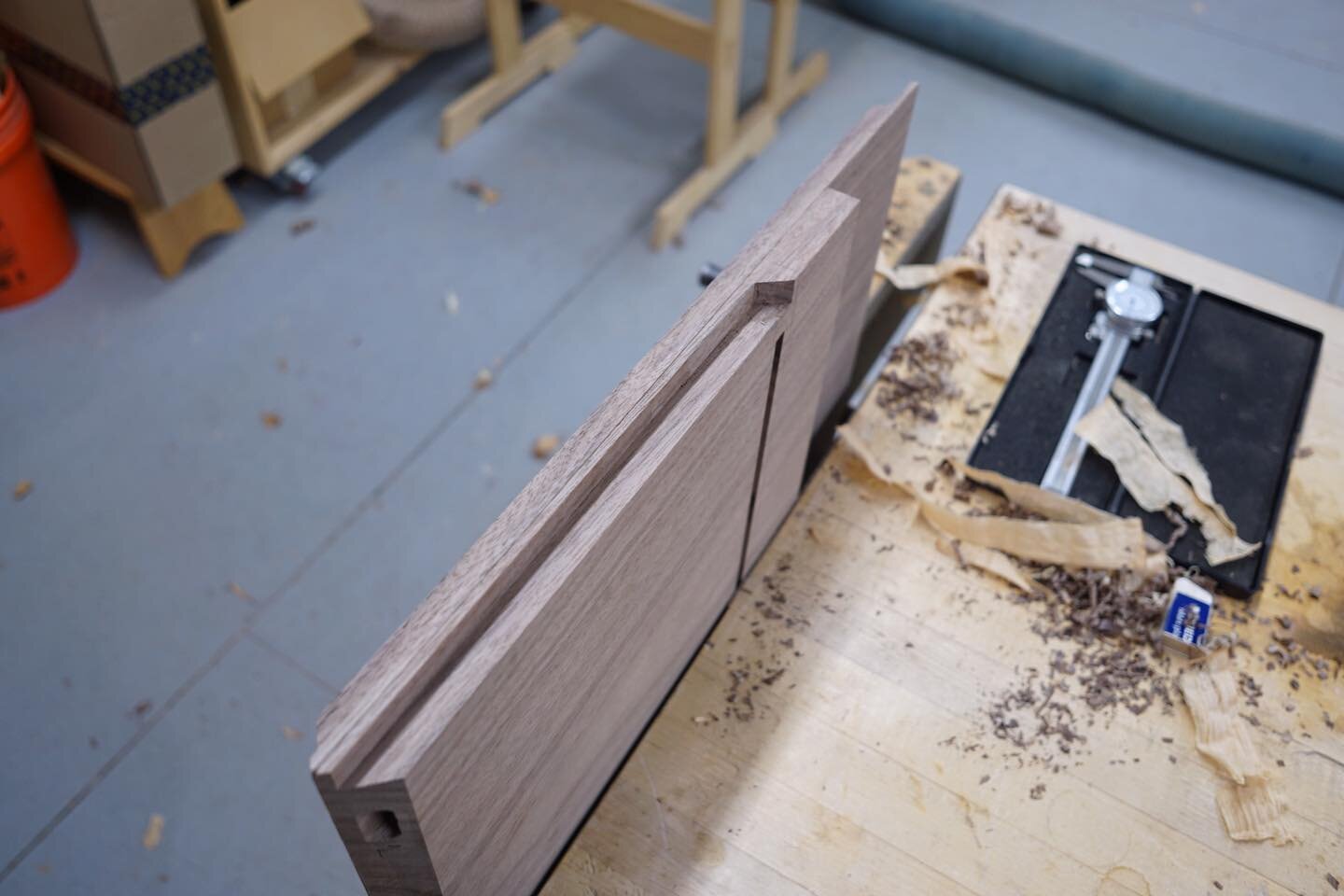 I cut the dado for the back right before I did the sliding dovetail for the shelf. What you&rsquo;re looking at in the piece that extends off into space is the side that will be cut off flush with the bottom of the case once it&rsquo;s glued up. Esse
