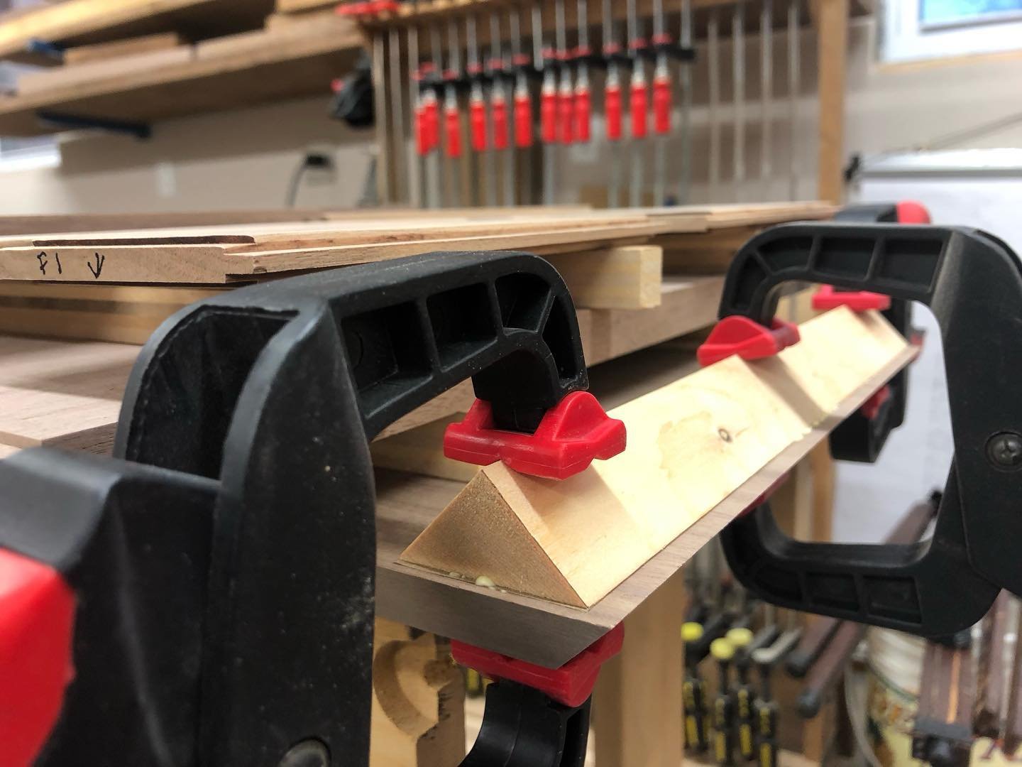 Gluing up the case. Such a simple idea. Gluing temporary cleats to help glue up the case. Just need to use news print or something similar in between so you can remove the cleats. Every time I do it I&rsquo;m always amazed this works

#walnutcabineto