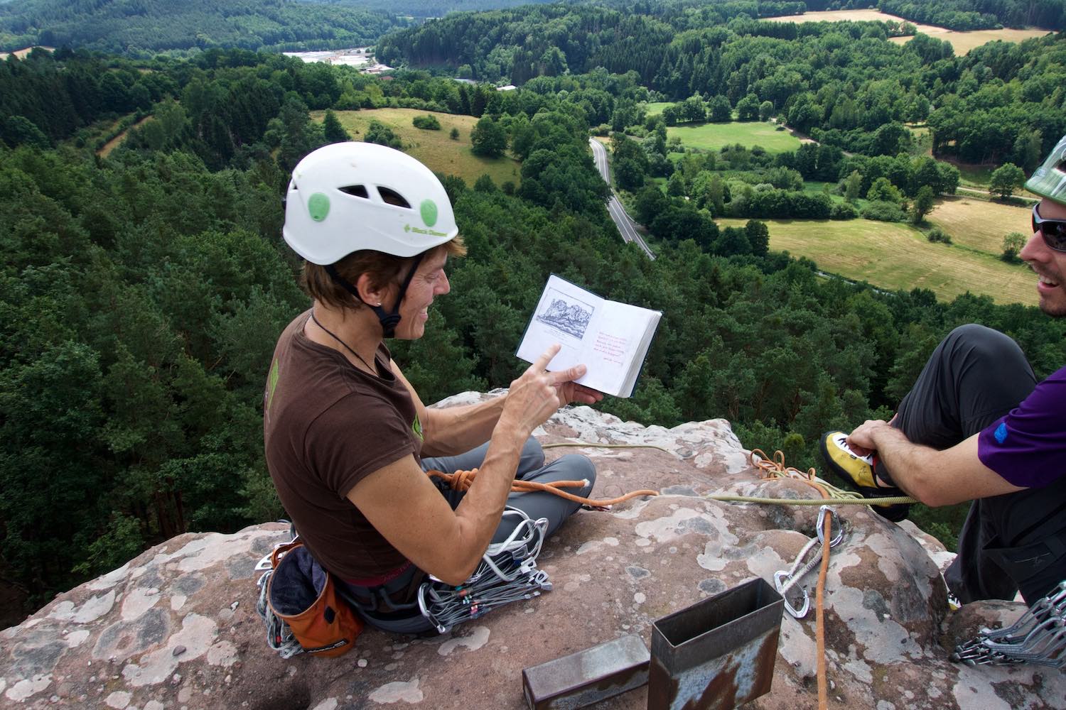  Climbing in Pfalz,&nbsp;signing a logbook on top of a tower 