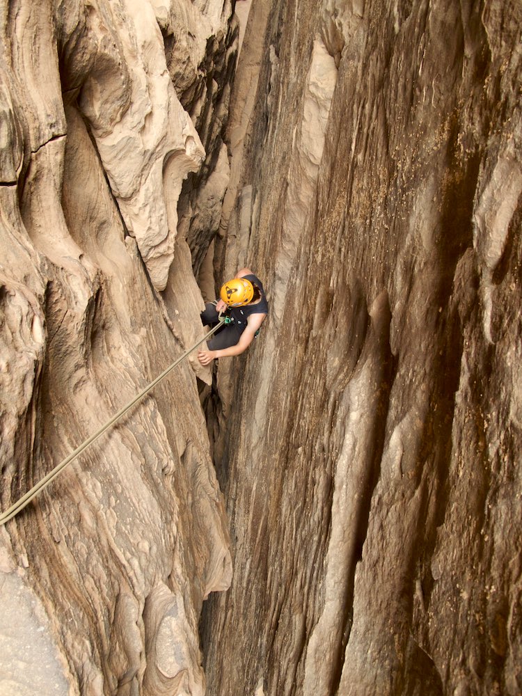  Tash descends into a narrow slot 