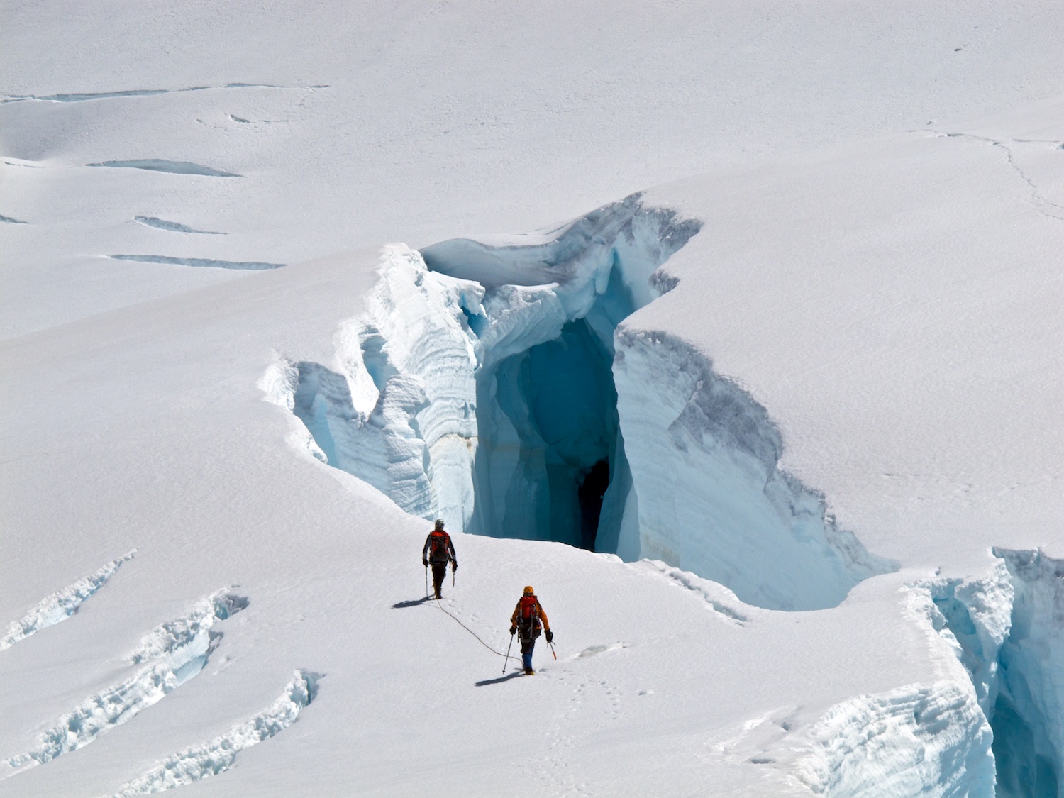  Marty and Vanessa dwarfed by a huge crevasse in the Hooker 