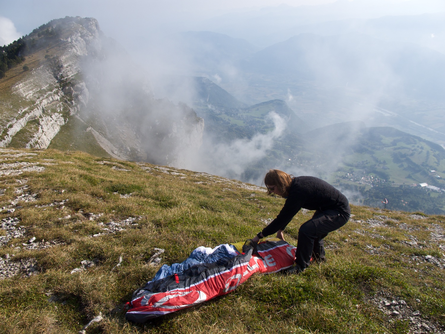  Tash laying out her glider in preparation to launch from Dent du Crolle 