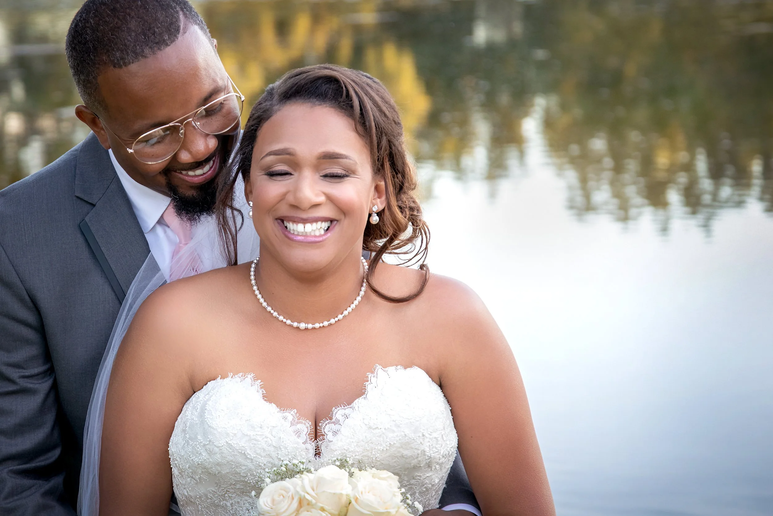 Affordable Sacramento wedding photographer candid wedding moment bride and groom laughing Ryan Michaels