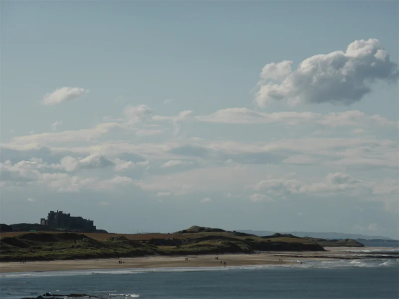 BEFORE: lovely "big skies" composition, but the castle is little lost, and the image is under exposed and static