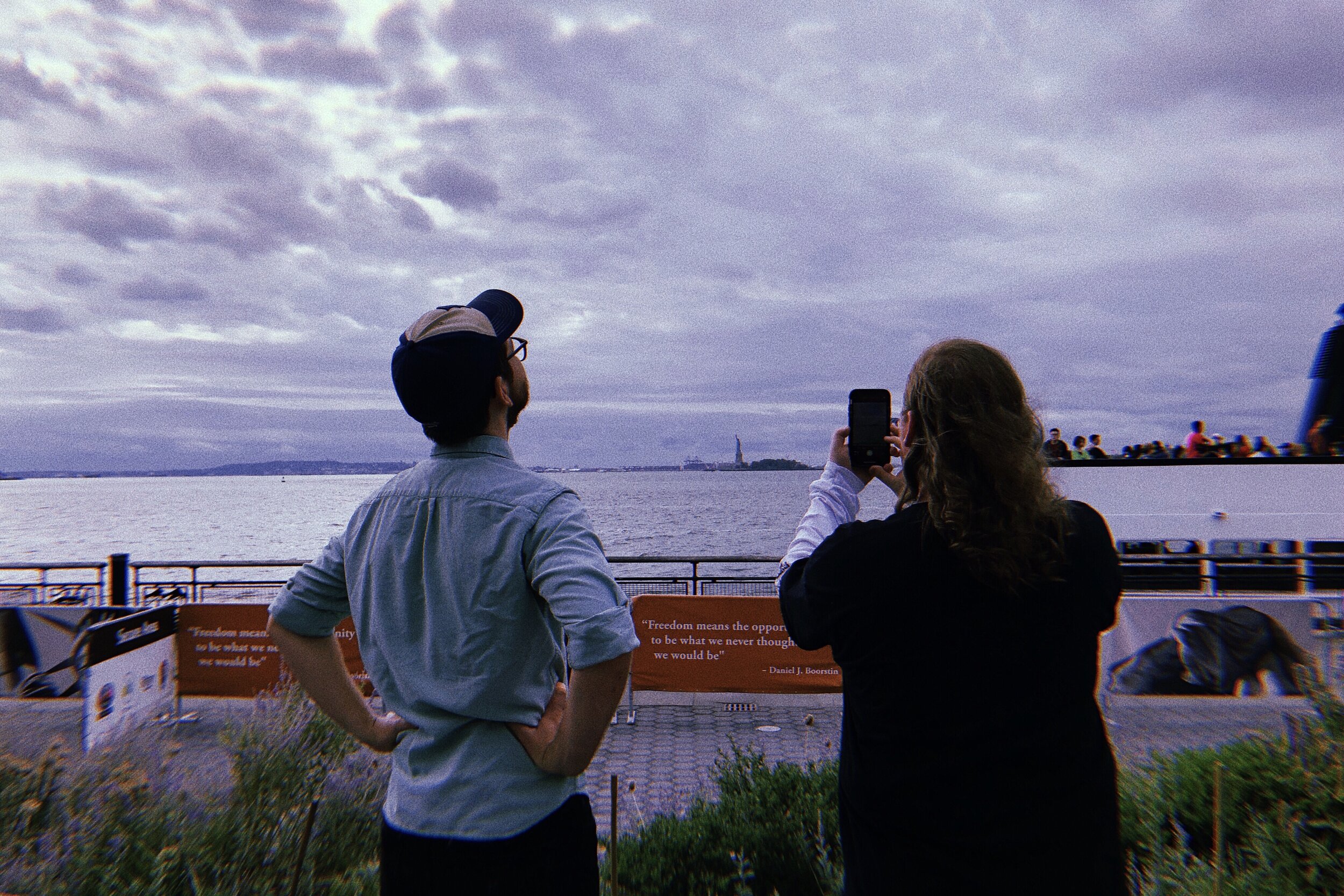  I can’t tell you how many weirdo dreams I’ve had about finally visiting New York. One of them consisted of the Statue of Liberty dancing ritualistically. She was pretty beautiful.  Also Traz can’t get over how small she looks in his phone camera. 
