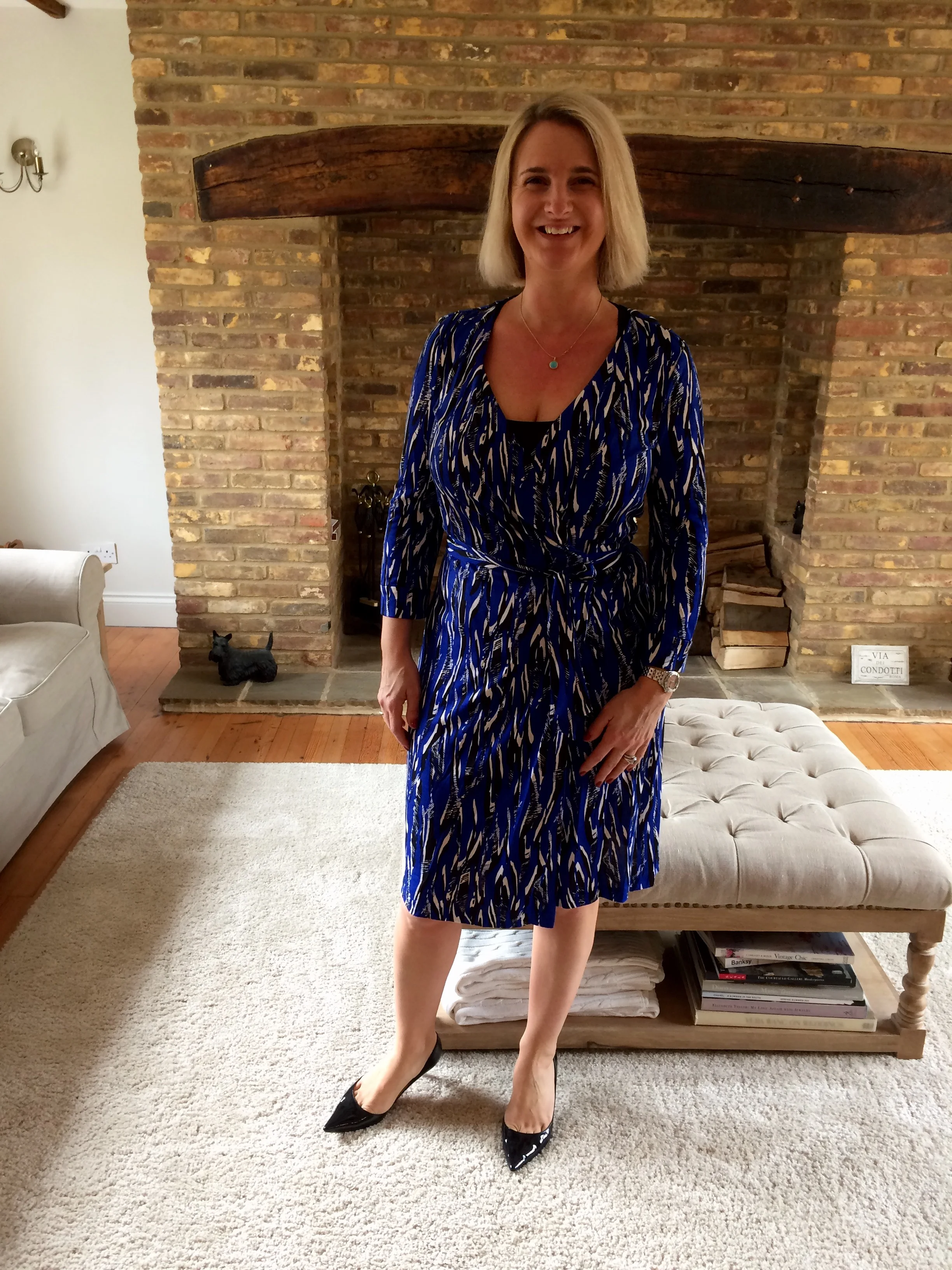 The Wrap from Diane Von Furstenberg, Shoes from Christian Louboutin. Smile all my own :) 