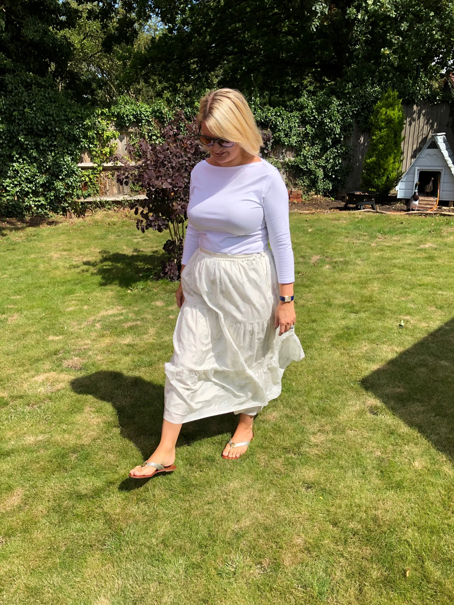 Top from Marks and Spencer, Skirt from Athena Procopiou, Shoes from Tory Burch.