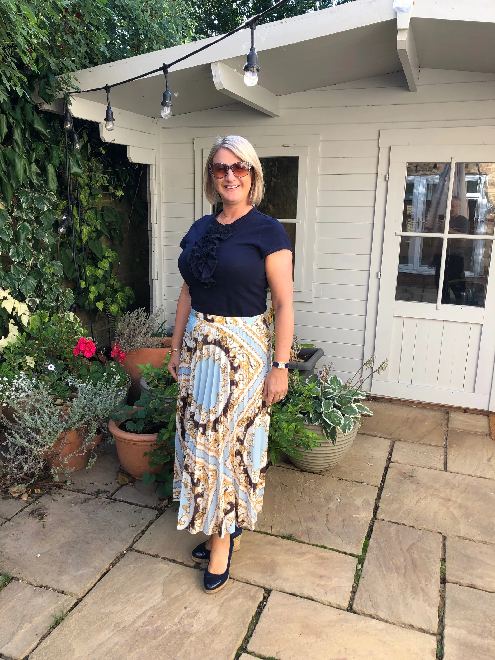 Top from Ralph Lauren, Skirt from Tesco, Shoes from Russell and Bromley.