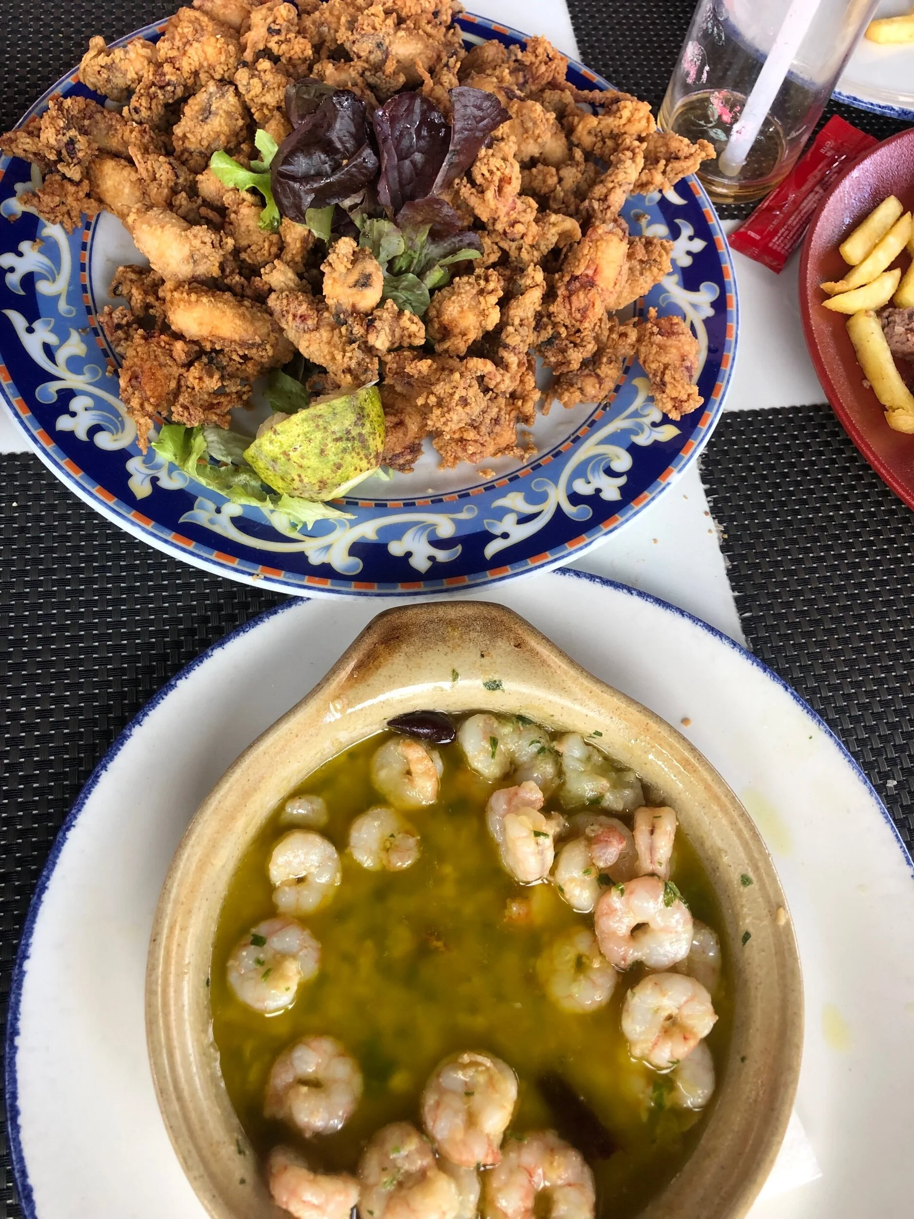 Fried baby squid, prawns in garlic butter followed by paella, followed by ice cream. Carb load heaven.