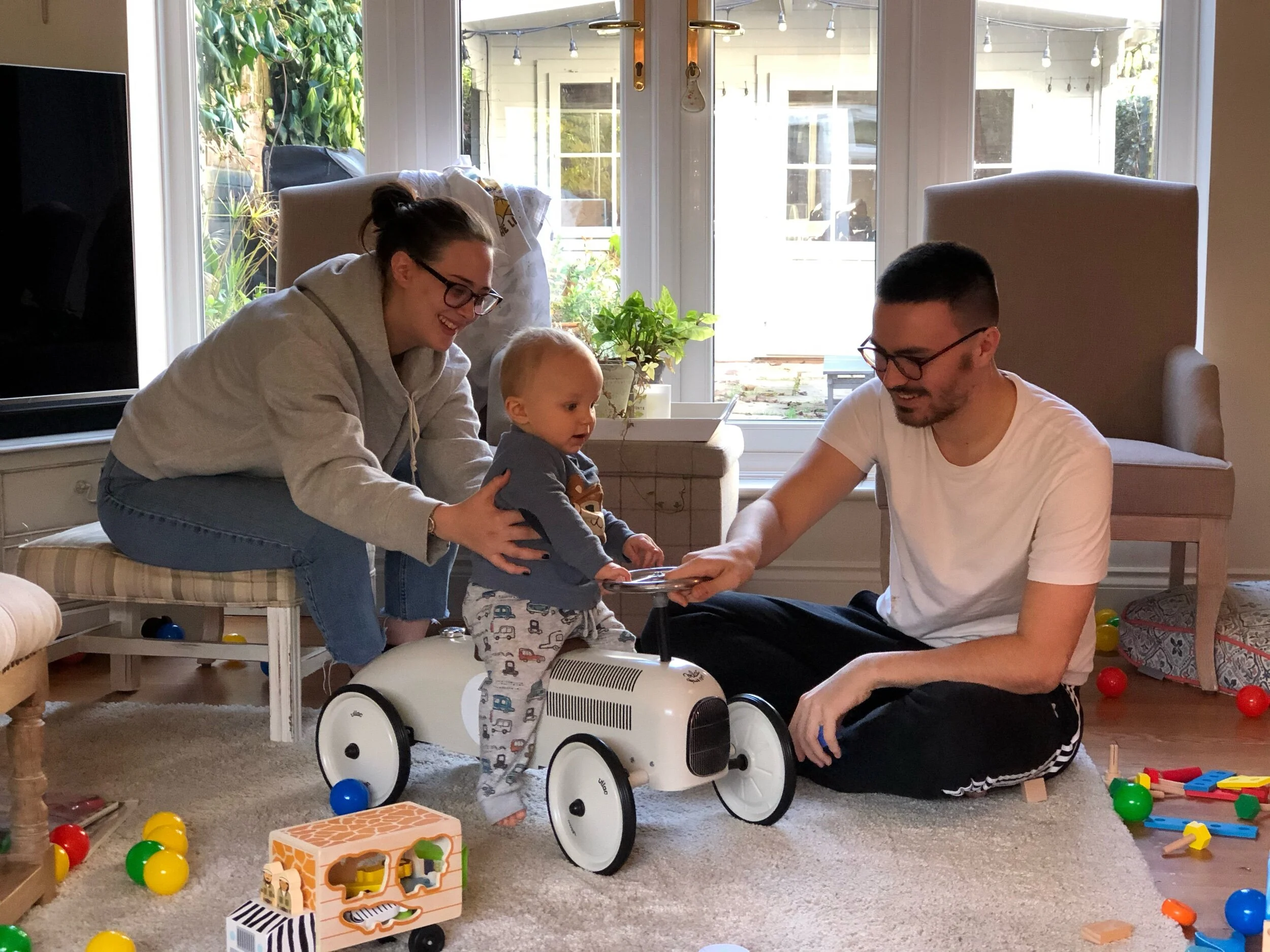 Auntie Kaitlyn and Uncle Ben having fun with Zak.