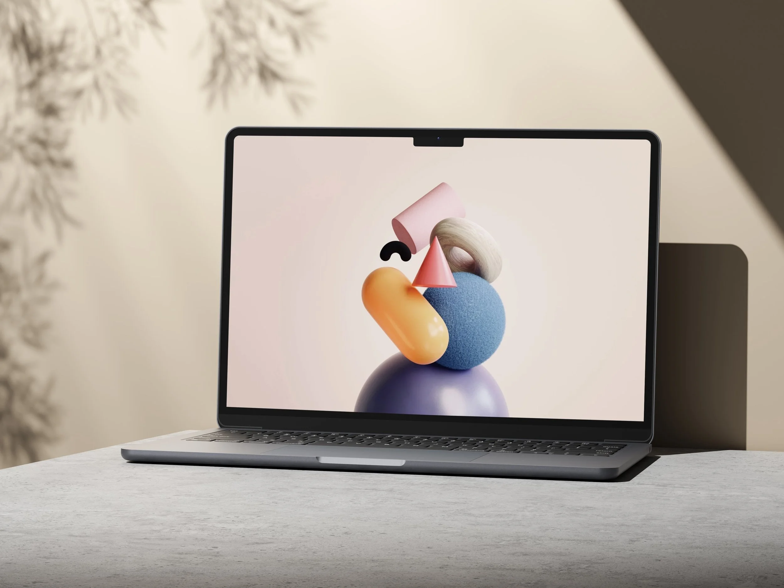 zeigt macbook mit 3D-Grafik auf Tisch vor Wand