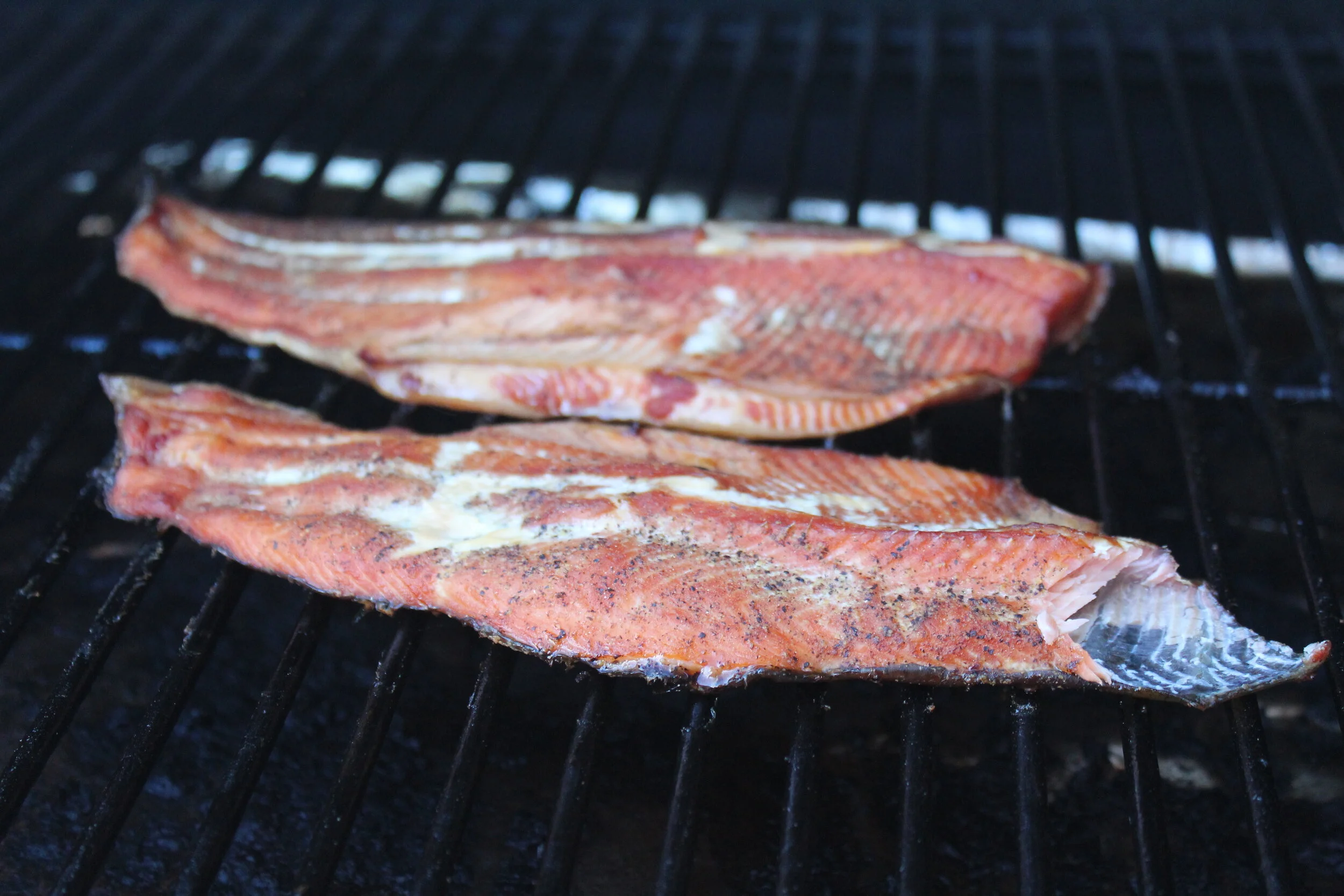 Smoke at 225 degrees until it flakes off the skin.  Best eaten hot!