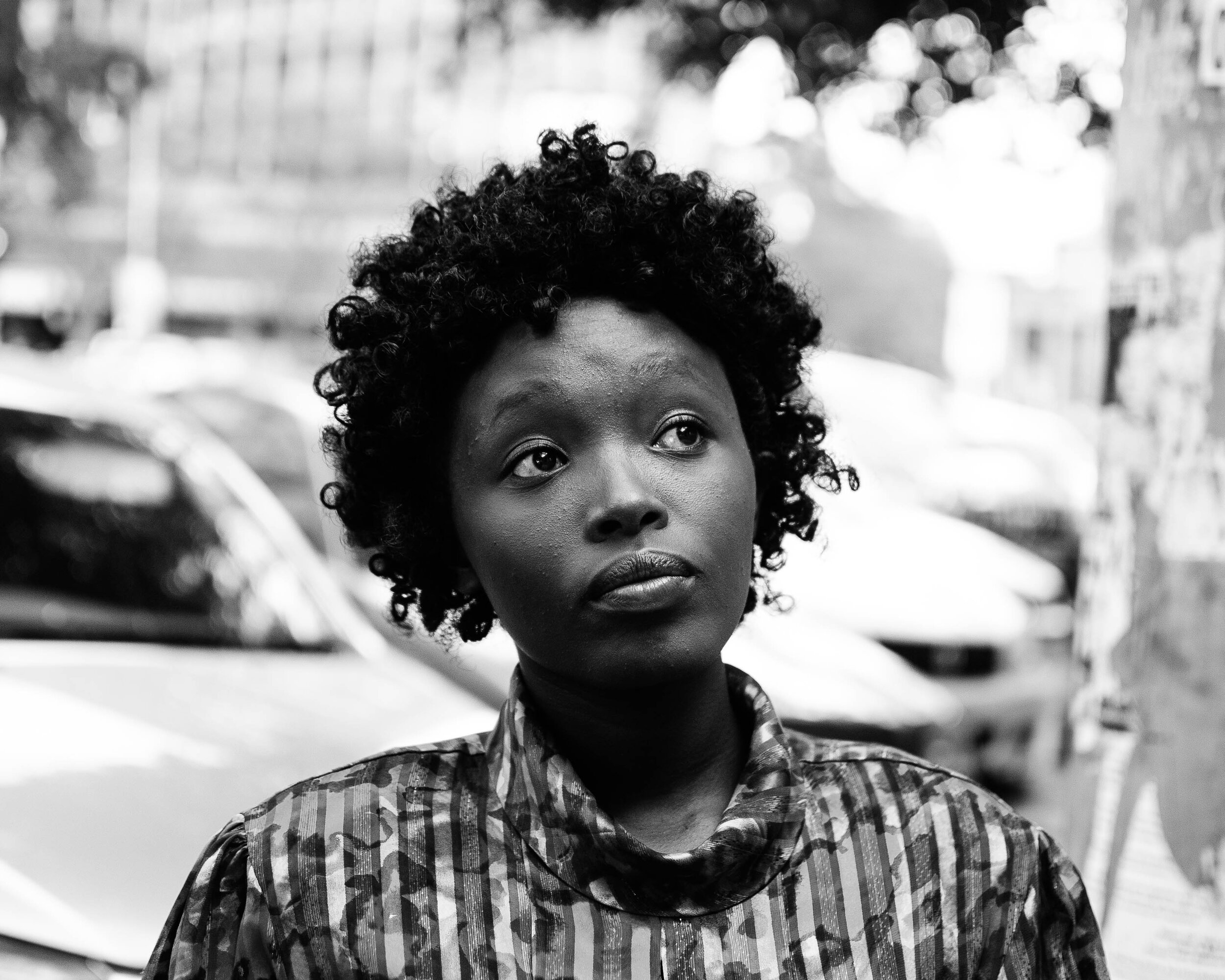 Canva - Woman With Curly Hair Looking Up Grayscale Photography.jpg