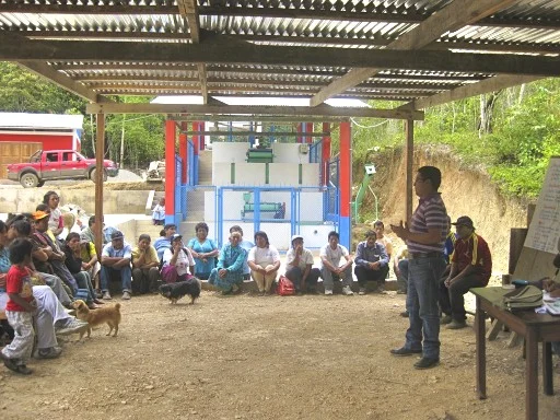 Paul Figueroa and farmers learning about sustainable practices and processing