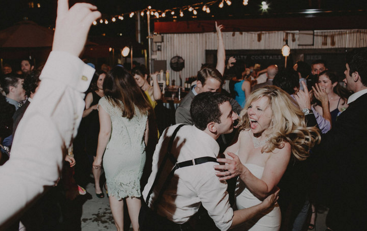 A happy bride and groom who booked MIXTAPE: &nbsp;A cover band for hipsters for their wedding. Photo:&nbsp; &nbsp;   Chellise Michael Photography