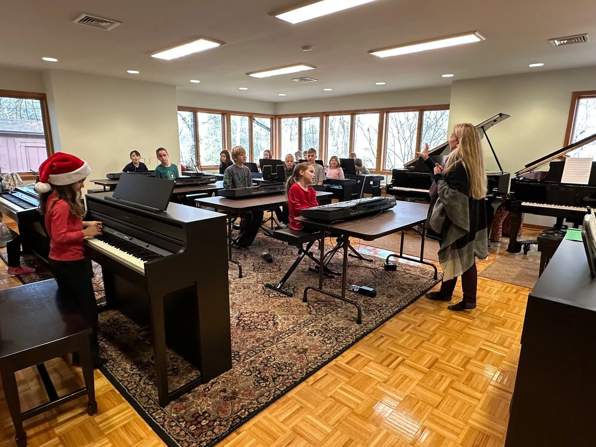 We have about 7 or 8 Saturday Workshops during the school year, and in early December, we bring out our 13 keyboards and set them up in our largest studio. We use the keyboards for playing Holiday Ensembles at our Enrichment Class week, but during th