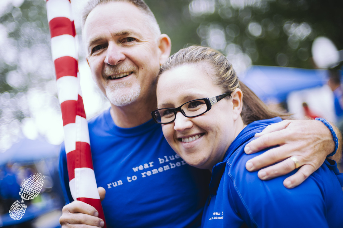 Teresa Maggart with wear blue community member and running partner Denny Bernardy at the JBLM Chapter 2014 Memorial Day Run. Photo courtesy Ingrid Barrentine/Grit City Photography.
