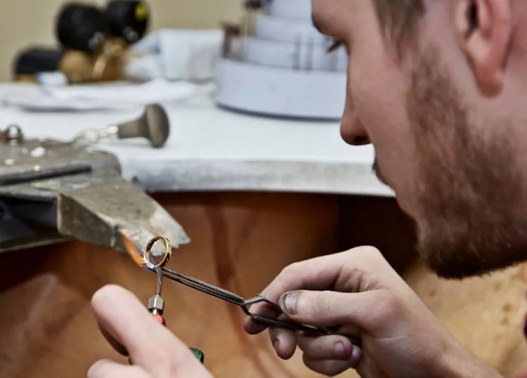 Matt working at his bench in the workshop