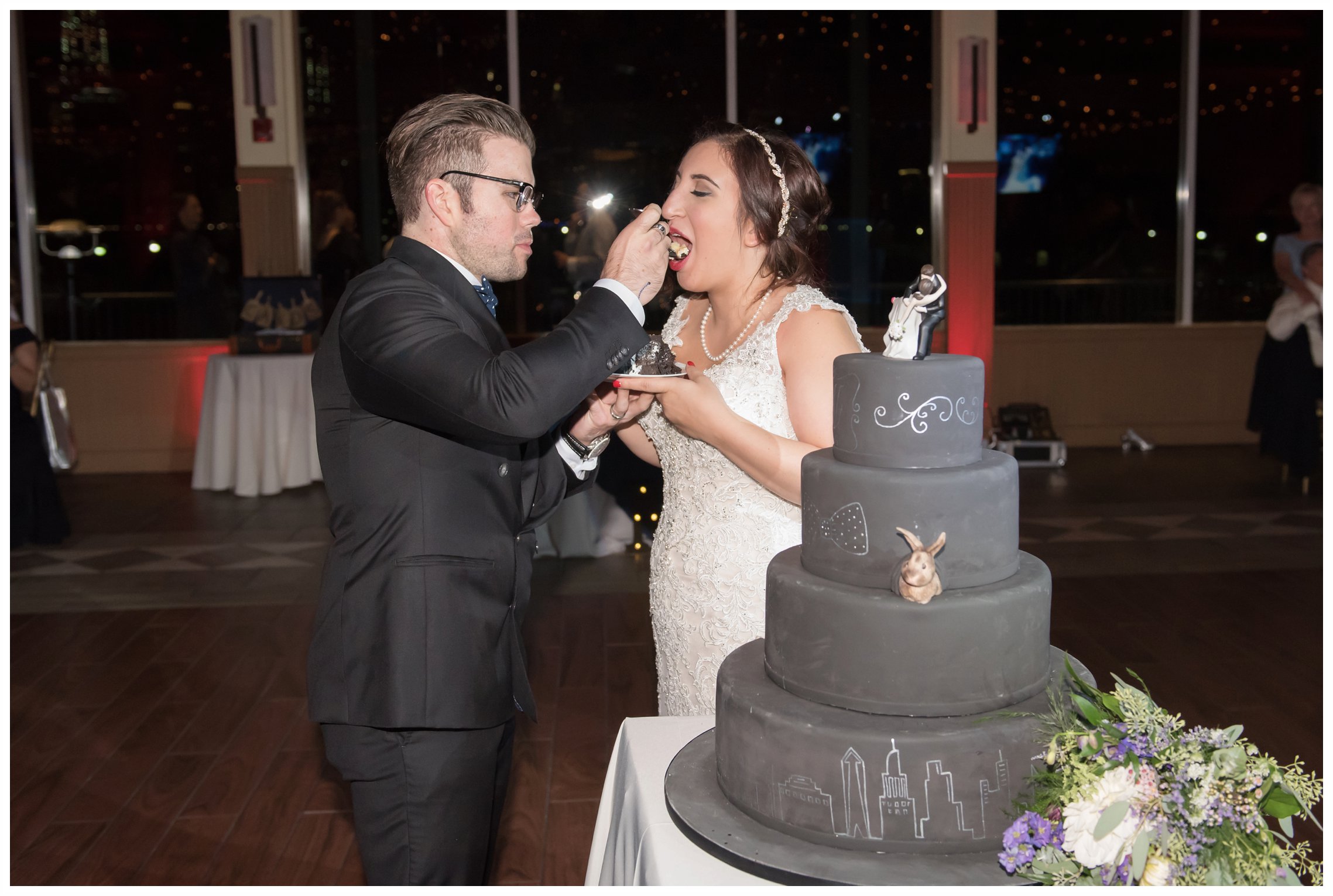 bride and groom cake cutting at the wedding at the liberty house restaurant in jersey city new jersey