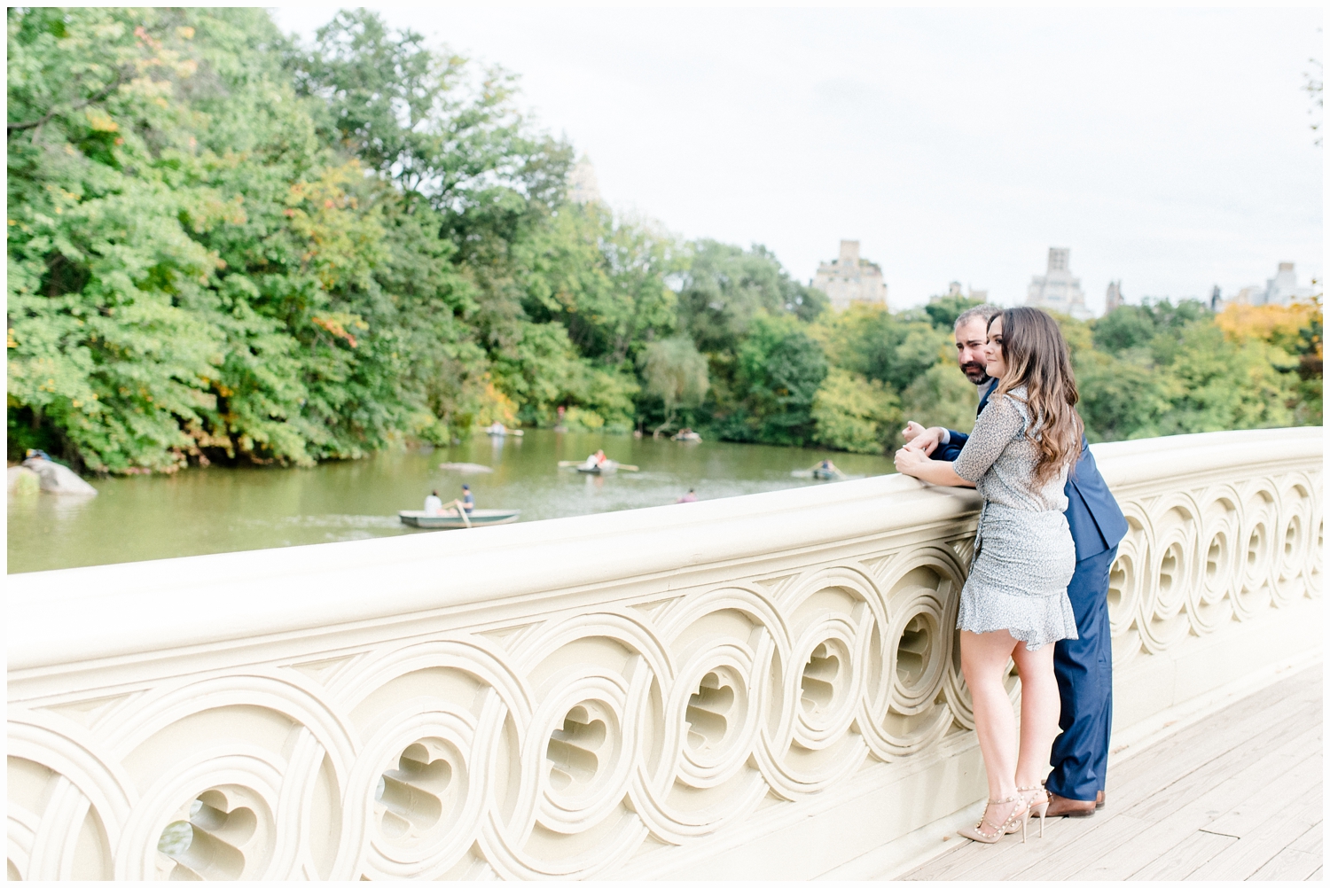 engaged couple on bow bridge