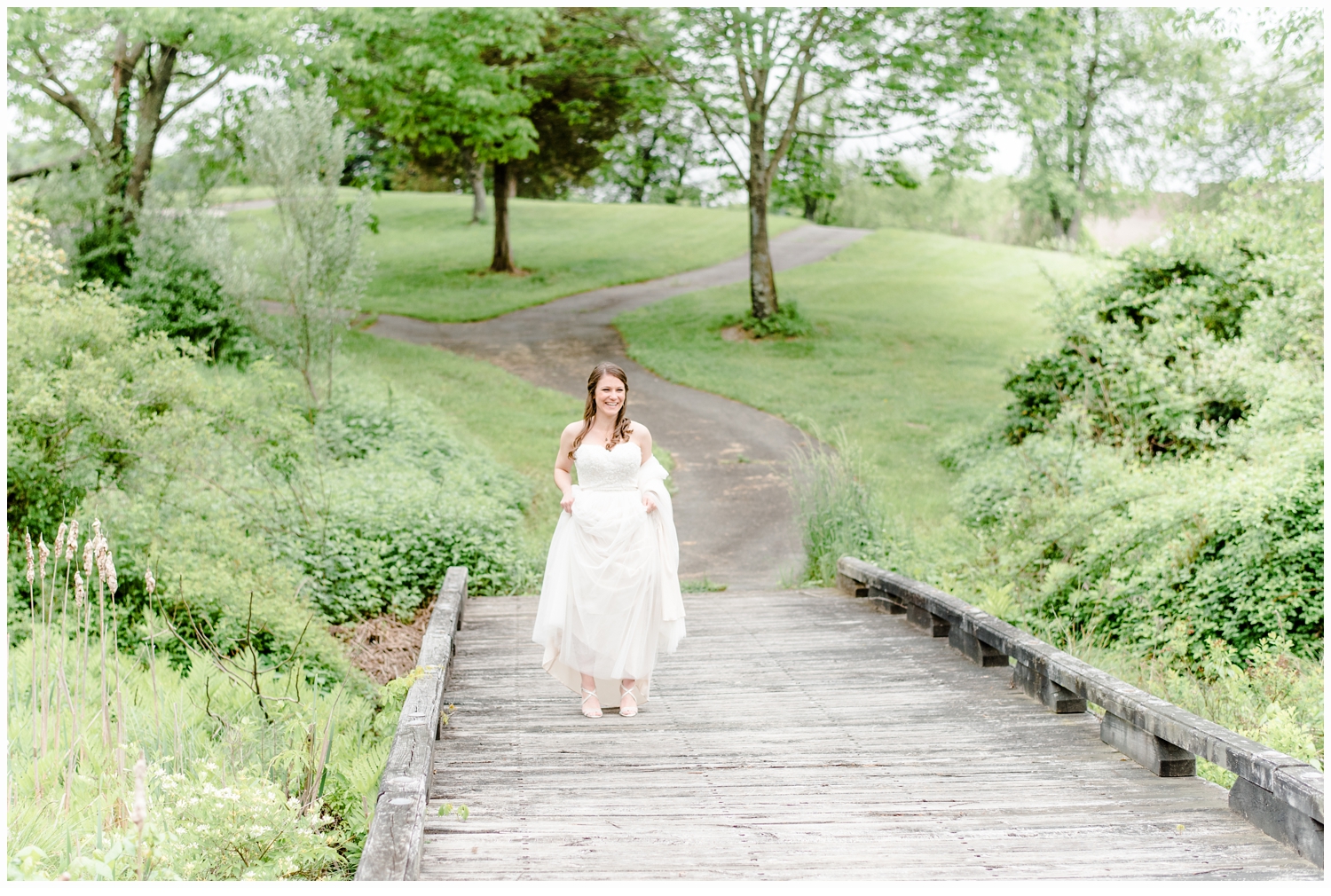 bride on bridge on wedding day