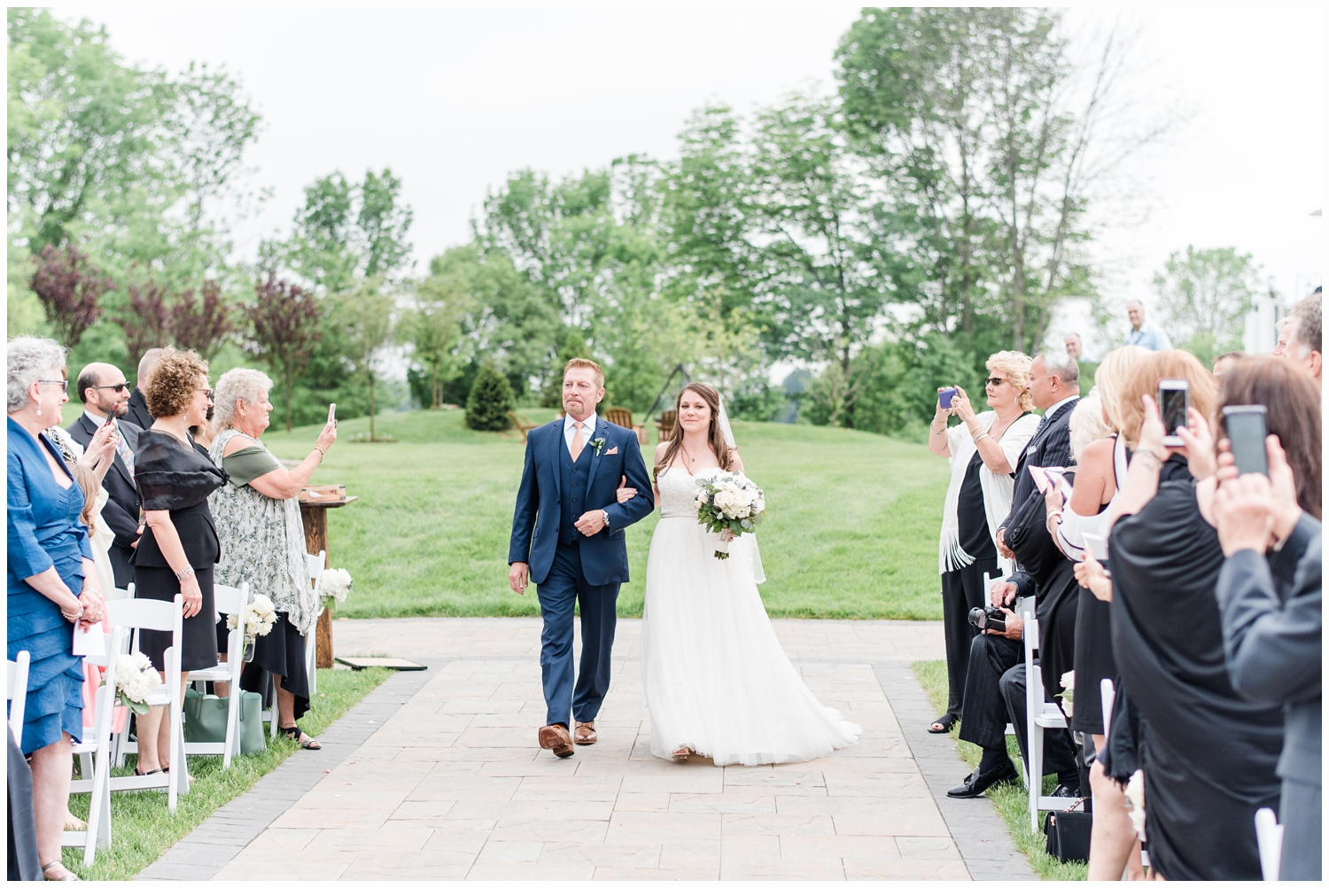 bride and father walking down aisle at wedding