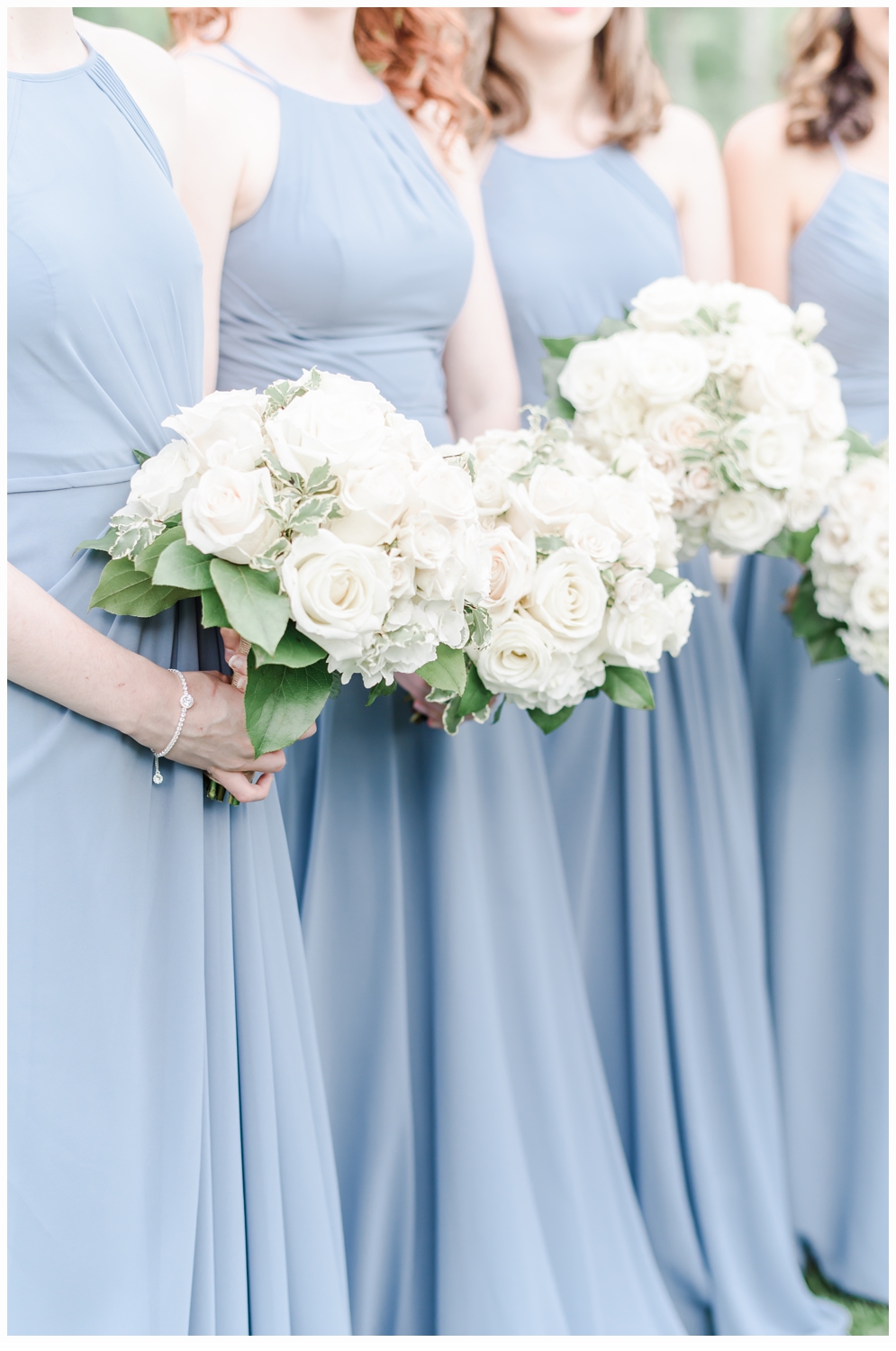 bridesmaids carrying bouquets