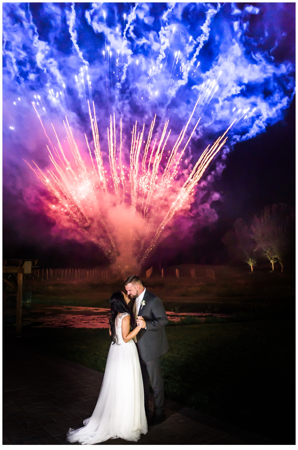 bride and groom watching fireworks