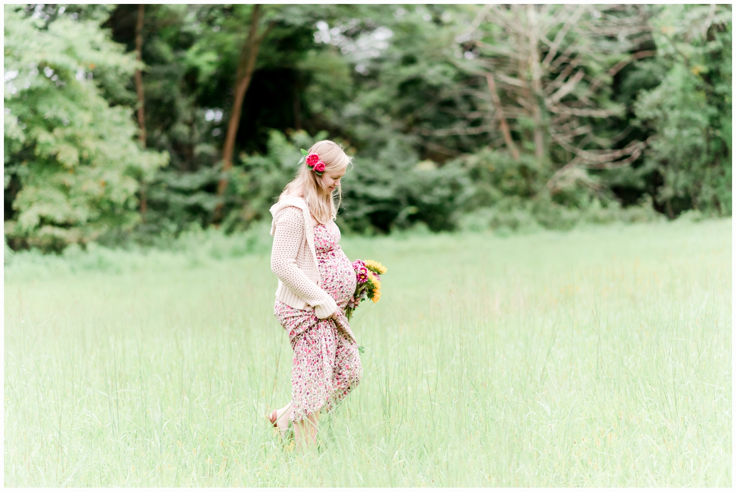 pregnant woman walking in field