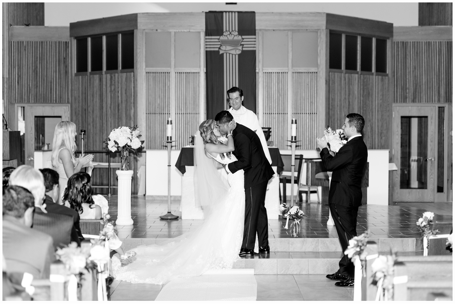 bride and groom kissing at church