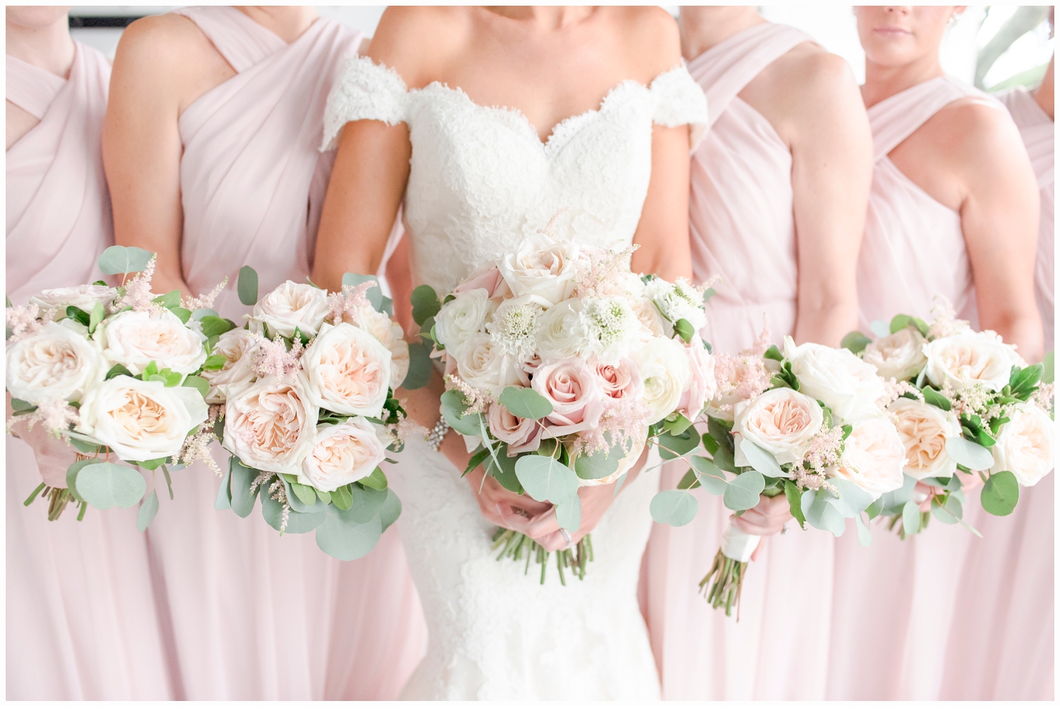 bridesmaids holding wedding bouquets